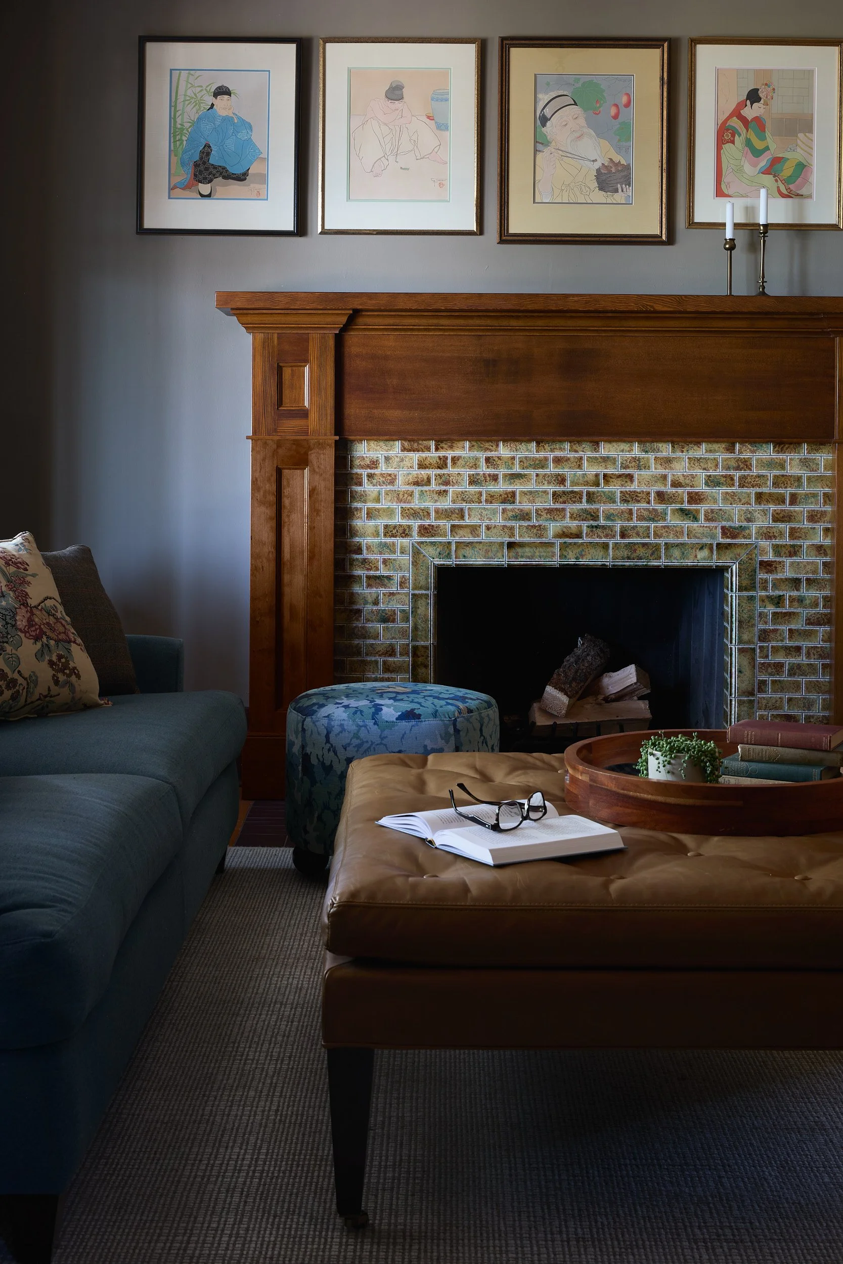 Close-up Hygge fireplace in the Old Tacoma Residence living room, featuring a custom mantel, natural materials, and design by Cupboard & Clay and Sonju Interiors.