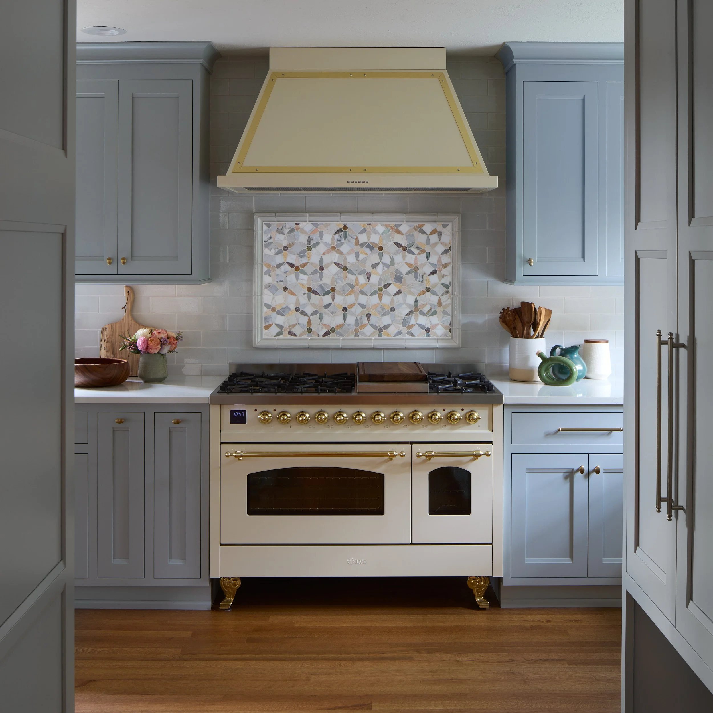 WPA North Tacoma Kitchen designed by Leslie Jensen, highlighting the custom stove, hood, and tile by C&C, built by Reier Construction.