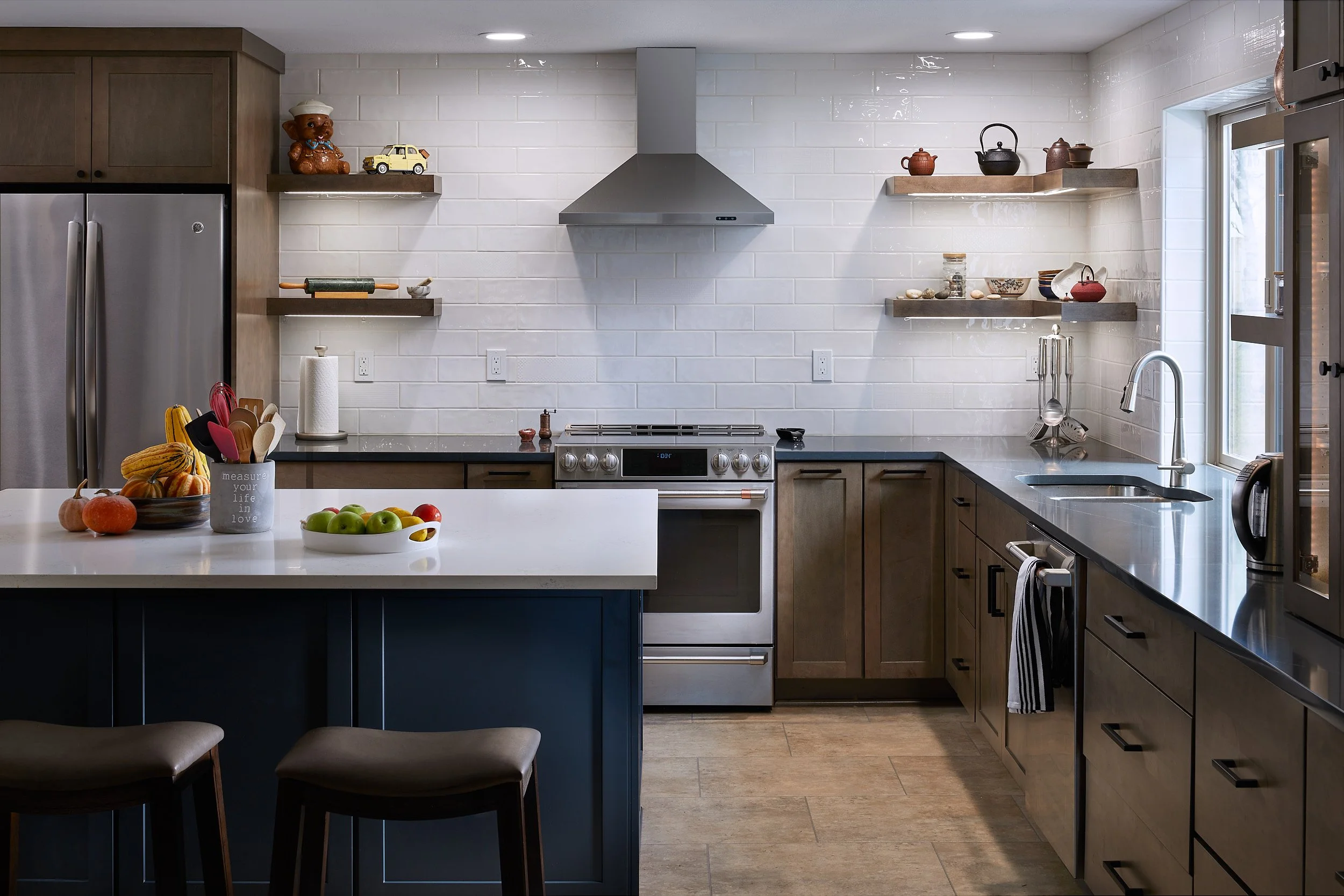 Modern kitchen remodel in Olympia, WA, featuring new custom cabinetry, stainless steel appliances, and a large central island by CW Construction.