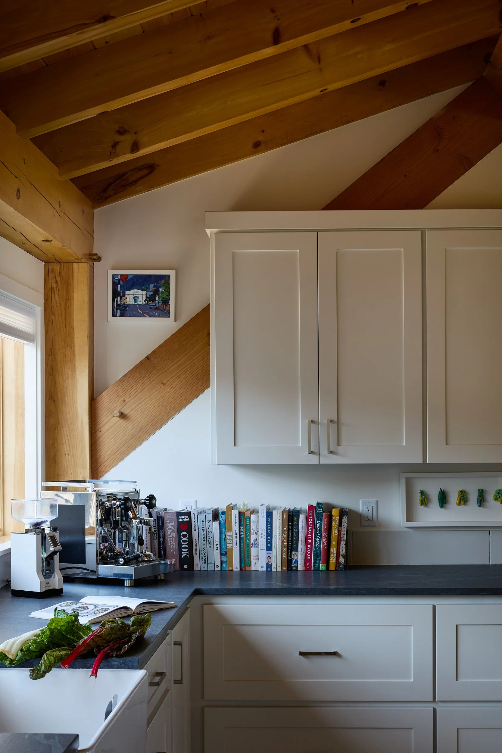 Vertical corner kitchen detail in the Rangeley Timber Frame Barn Home (Ridgefield, WA), built for The Barn Yard.