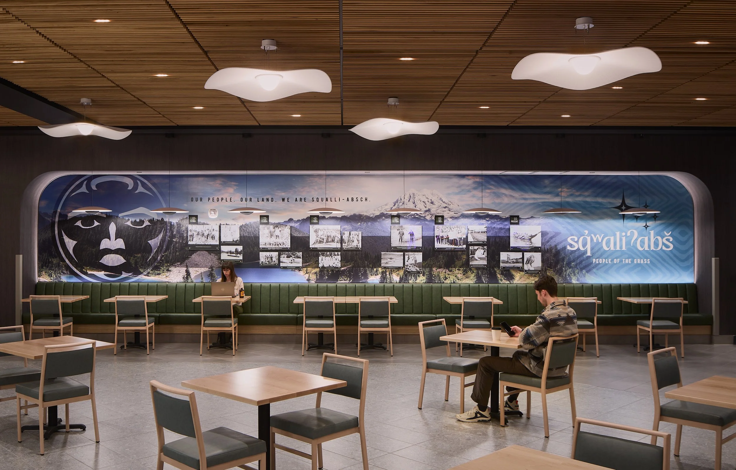 Interior architectural detail image showcasing native artwork and cultural design elements in the back seating area of The Delta Food Hall at Nisqually Red Wind Casino, designed by Rice Fergus Miller.