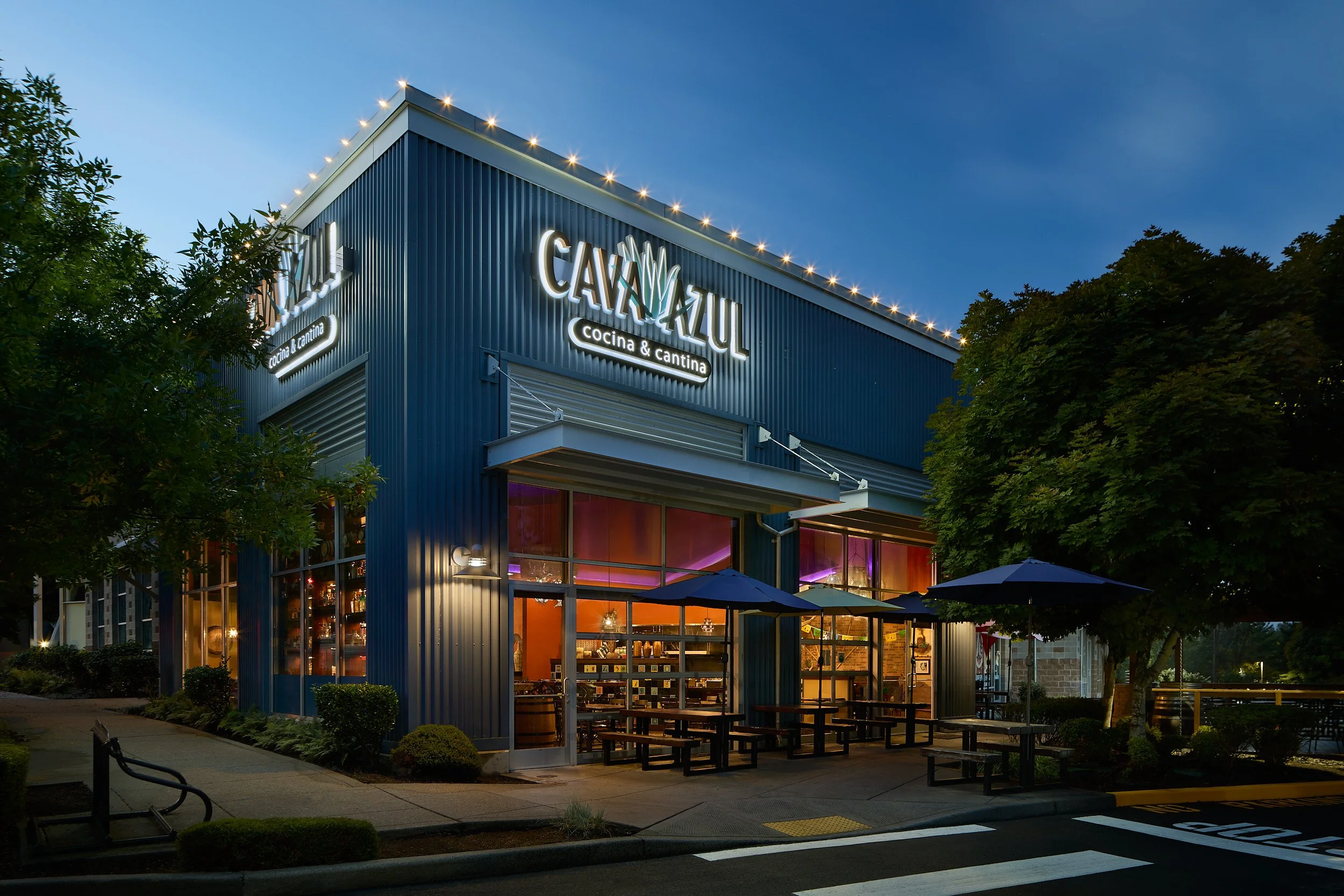Twilight architectural elevation of the modern Mexican restaurant Cava Azul in Woodinville, Washington, designed by Sue Genty Interior Design.