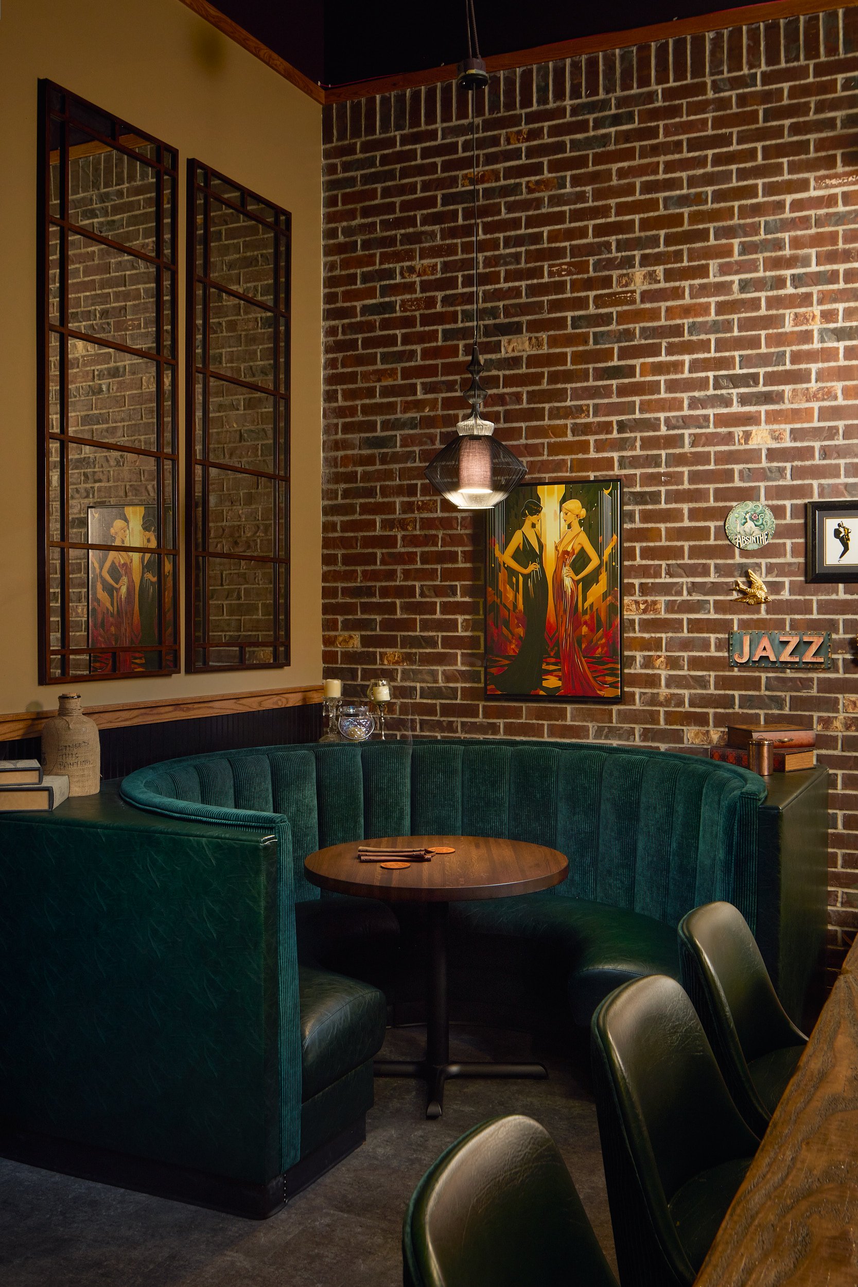 Interior architectural photography showcasing the hidden speakeasy and intimate gathering seating area at Side Hustle Local in Bothell, Washington, designed by Sue Genty Interior Design.