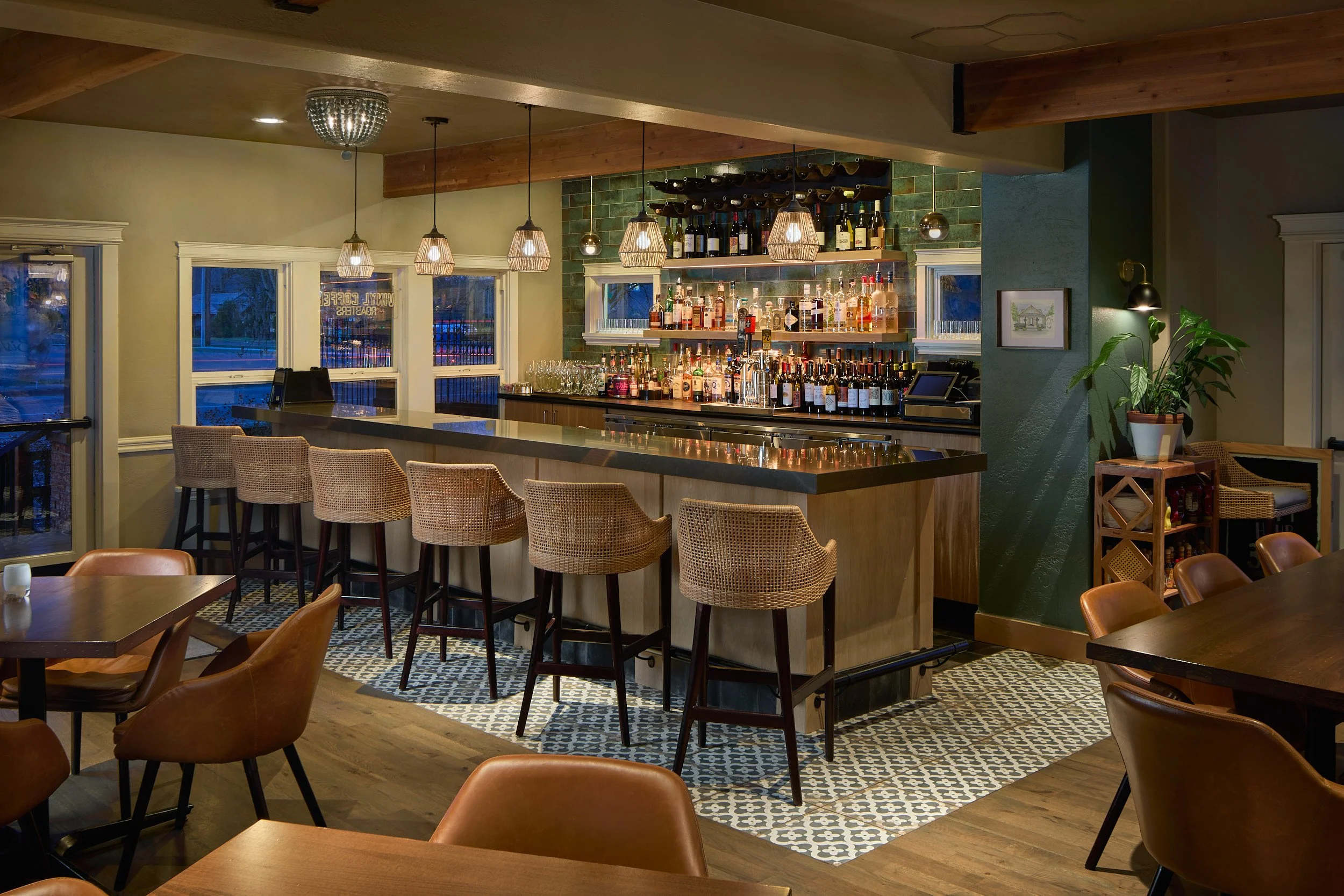 Interior architectural photography showcasing the beautifully designed bar area and warm dawn atmosphere at Windmill Bistro in Sumner, Washington, designed by Sue Genty Interior Design.