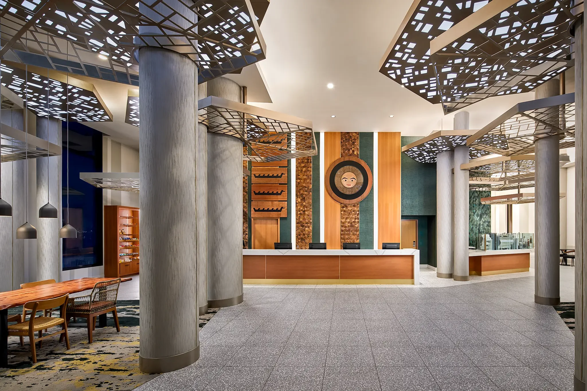 Hotel lobby interior and reception desk at Emerald Queen Casino Hotel, Tacoma, WA, designed by Cuningham Architects.