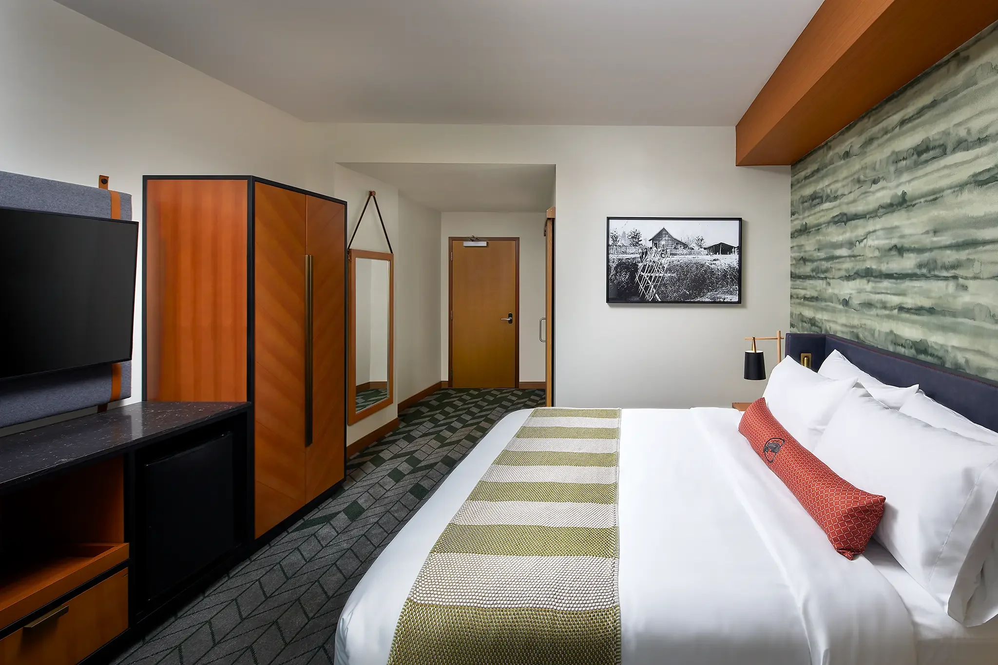 King guest room interior at Emerald Queen Casino Hotel, Tacoma, WA, featuring custom FF&E and interior design by Cuningham Architects.