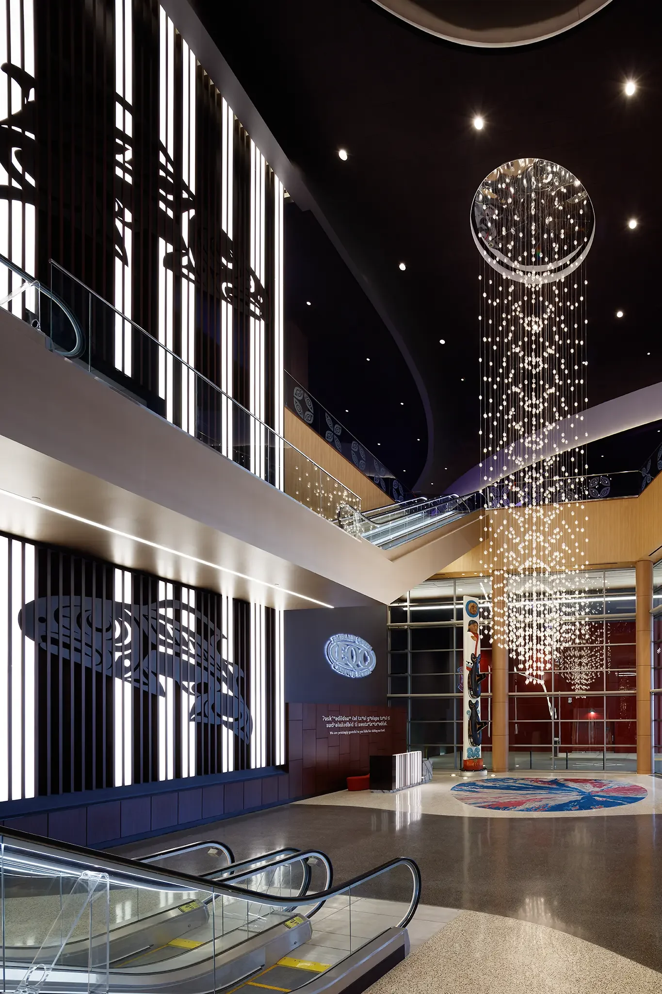 Casino interior featuring dramatic lobby and lighting feature inside the Emerald Queen Casino, Tacoma, WA, designed by Cuningham Architects.