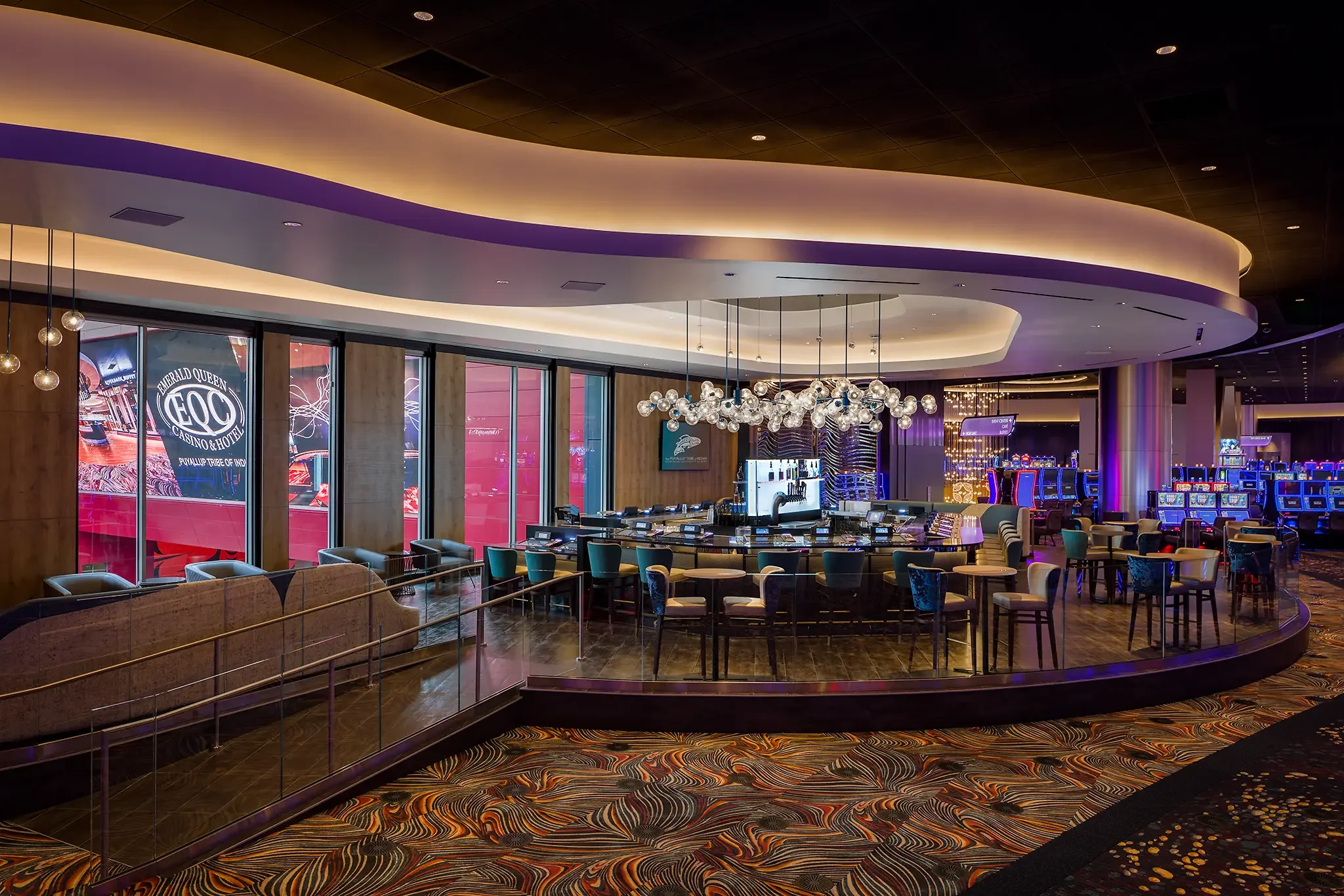 Gorgeous Center Bar design and detailed architecture inside the main gaming floor of the Emerald Queen Casino (EQC) project by Cuningham Architects.