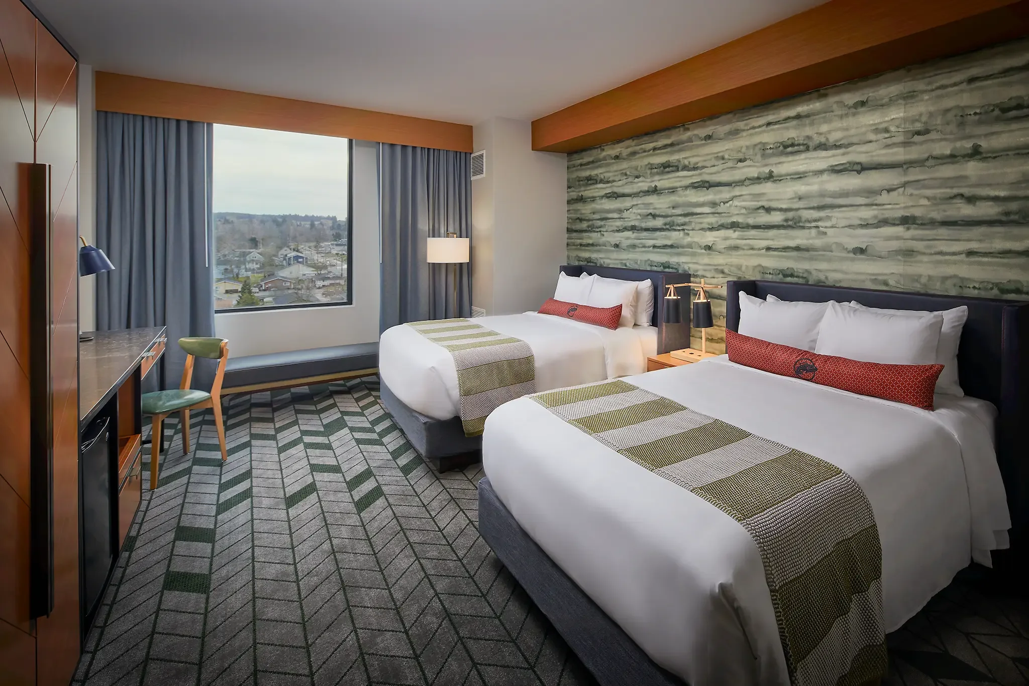 2-Queen guest room interior at Emerald Queen Casino Hotel, Tacoma, WA, featuring custom FF&E and interior design by Cuningham Architects.