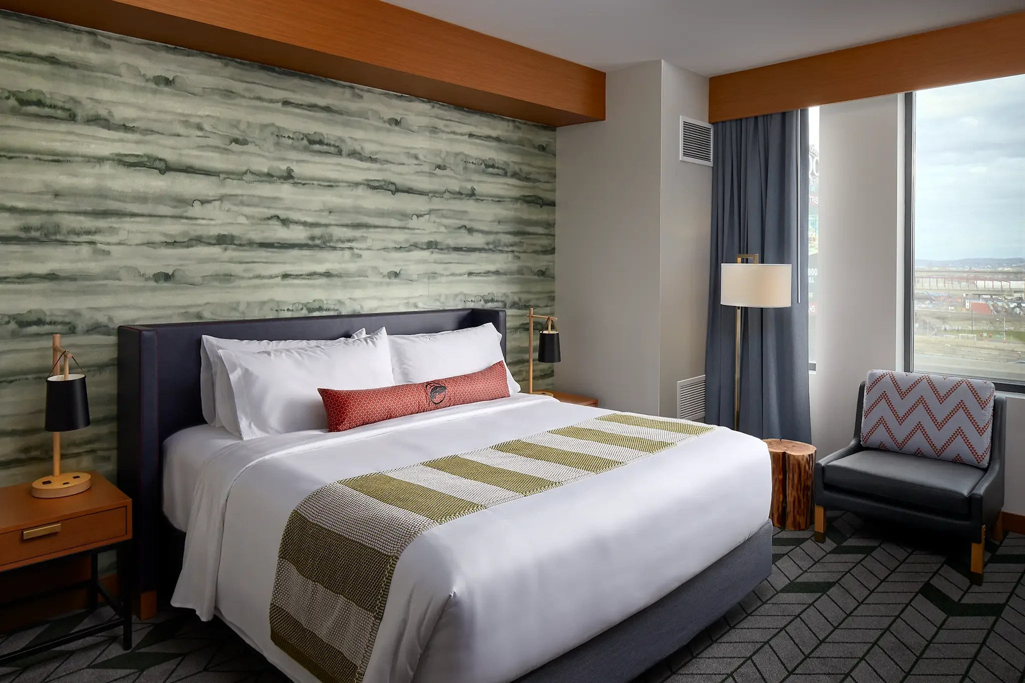 King guest room interior at Emerald Queen Casino Hotel, Tacoma, WA, featuring custom FF&E and interior design by Cuningham Architects.