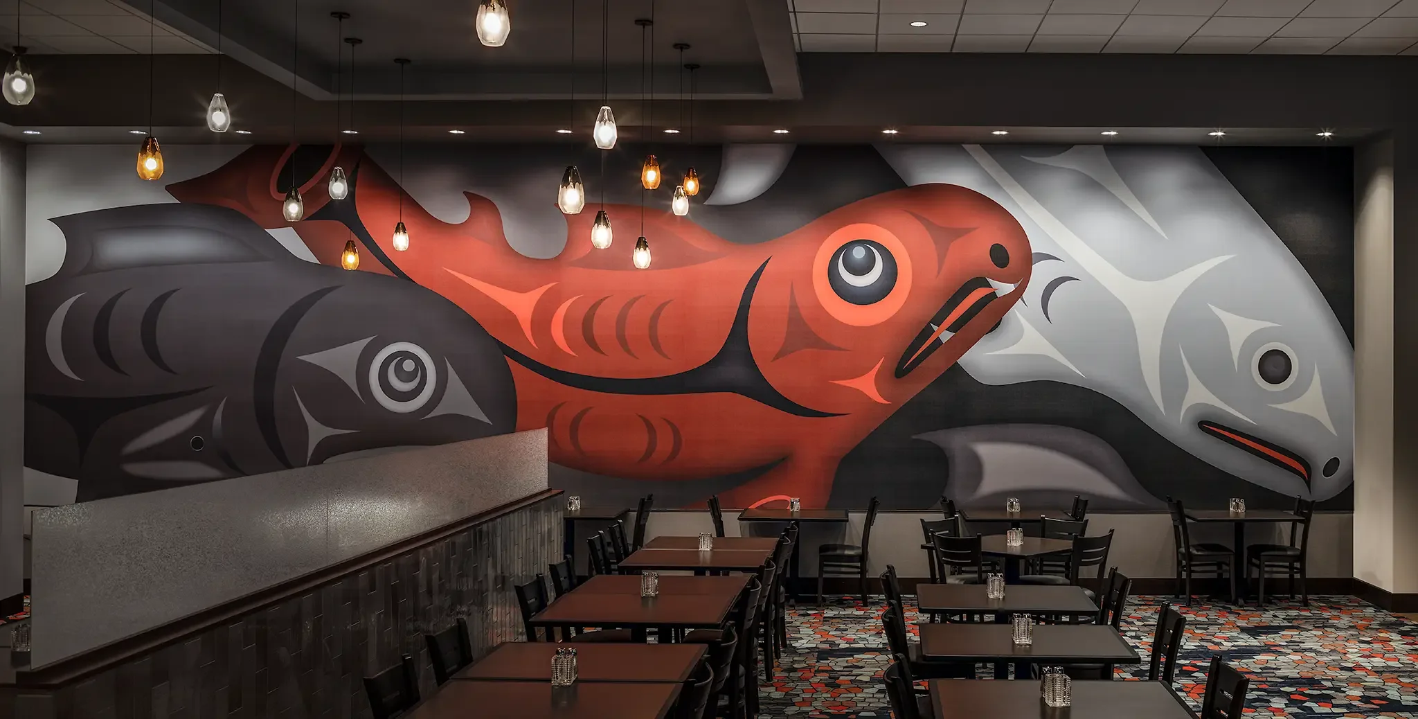 Native artwork and custom display installation inside the Emerald Queen Casino Hotel project in Tacoma, WA, designed by Cuningham Architects.