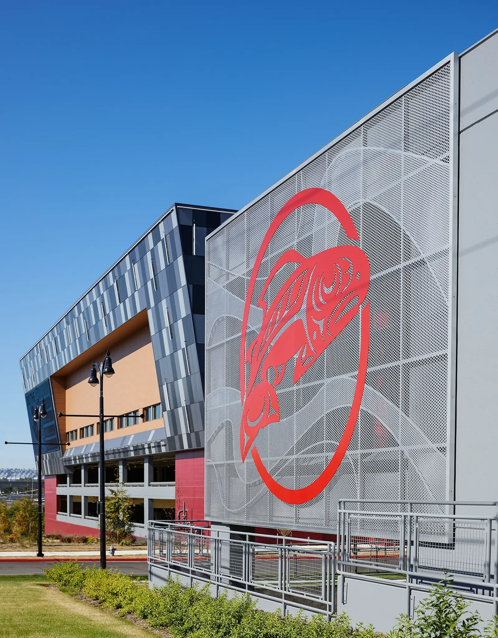 Exterior parking garage facade and unique artwork screening detail at the Emerald Queen Casino Hotel in Tacoma, Washington, designed by Cuningham Architects.
