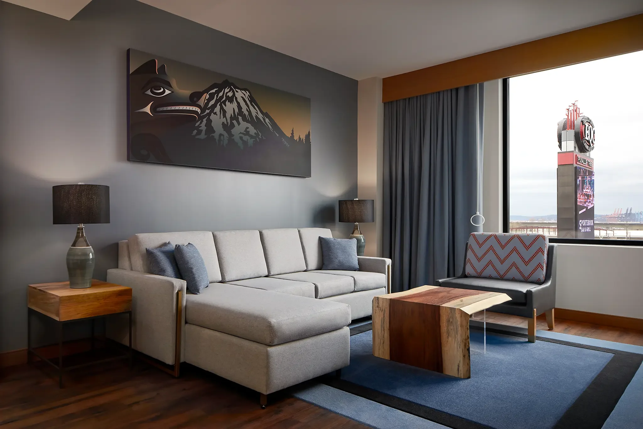 Suite seating area inside guest room interior design and custom FF&E by Cuningham Architects at the Emerald Queen Casino Hotel in Tacoma, Washington.