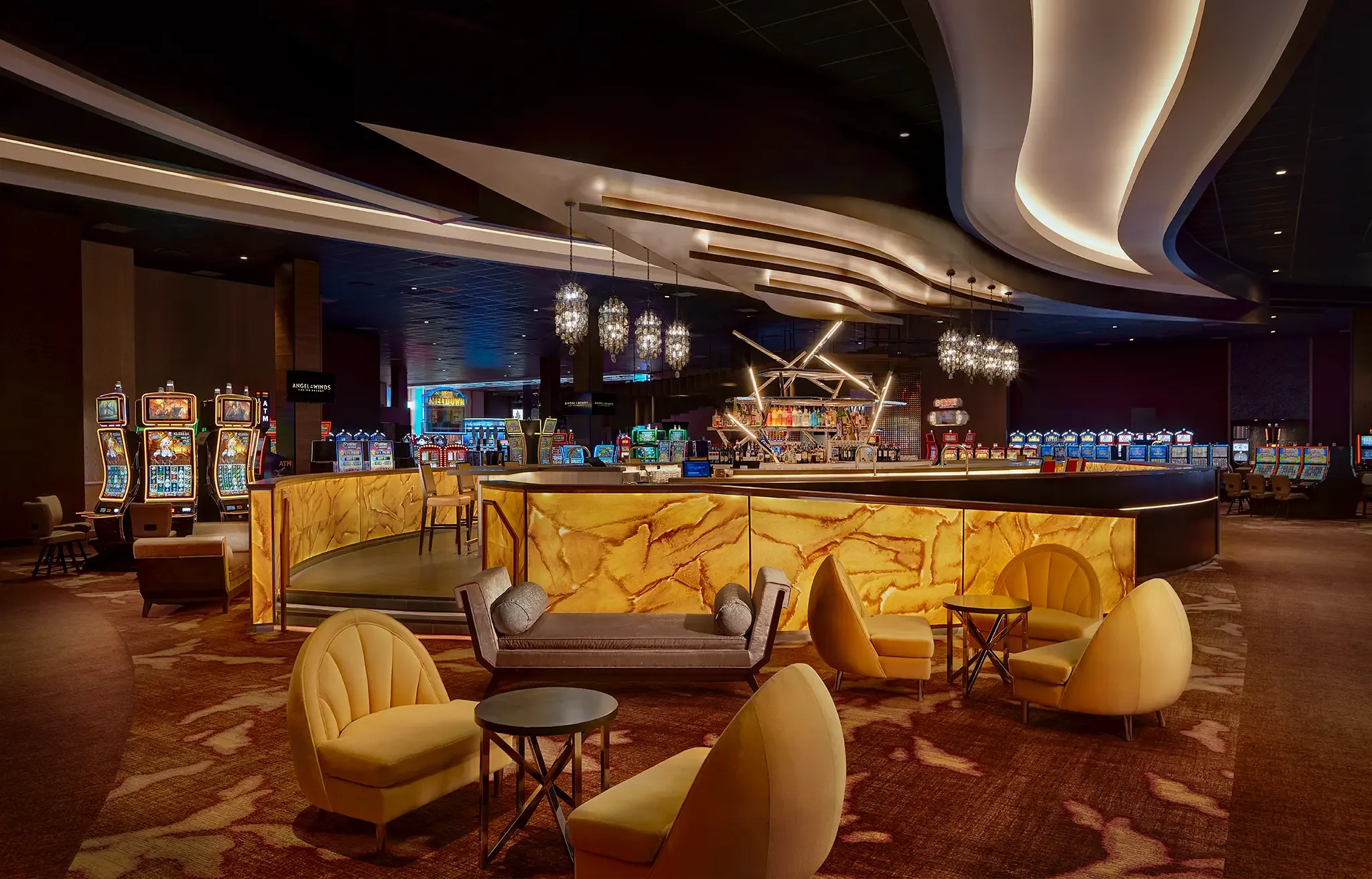 Architectural photograph of the contemporary lounge seating area adjacent to the Gravity Bar inside the Angel of the Winds Casino in Arlington, WA, designed by Cuningham Architects.