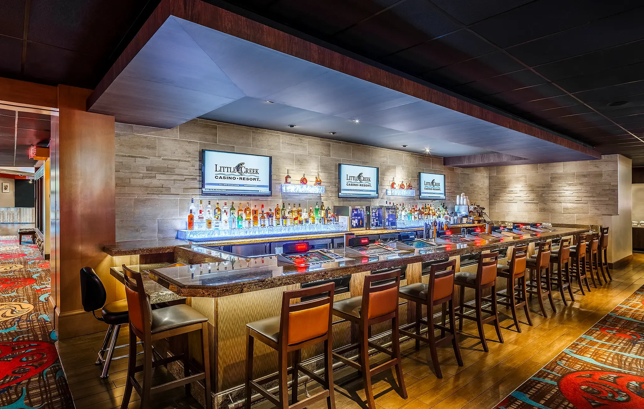 High-end bar interior at Little Creek Casino Resort, Shelton, WA, with custom lighting and architectural design by KMB Architects.