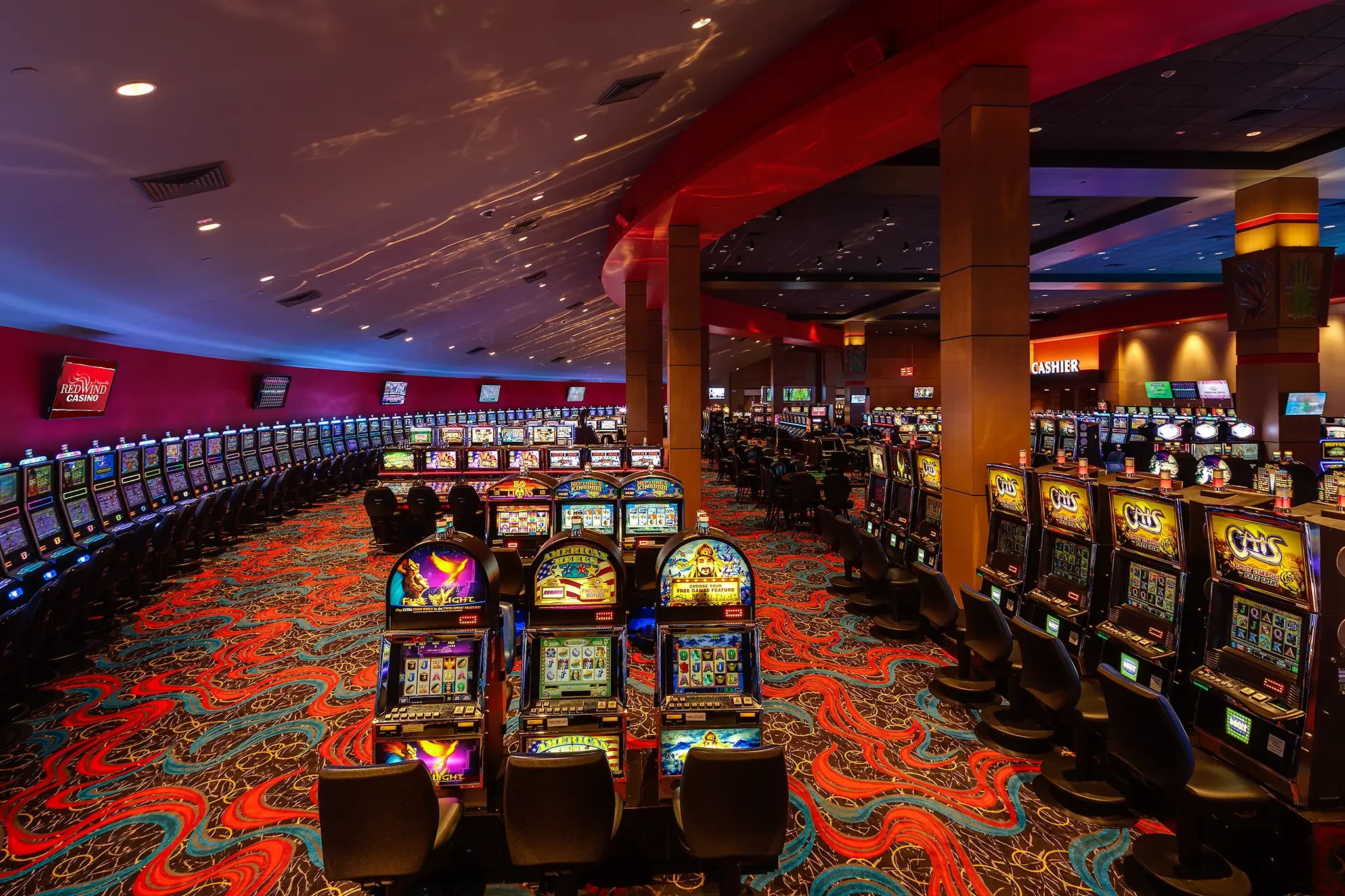 Architectural photograph showing the curved ceiling and lighting detail of the smoking gaming floor inside the Nisqually Red Wind Casino, designed by KMB Architects.