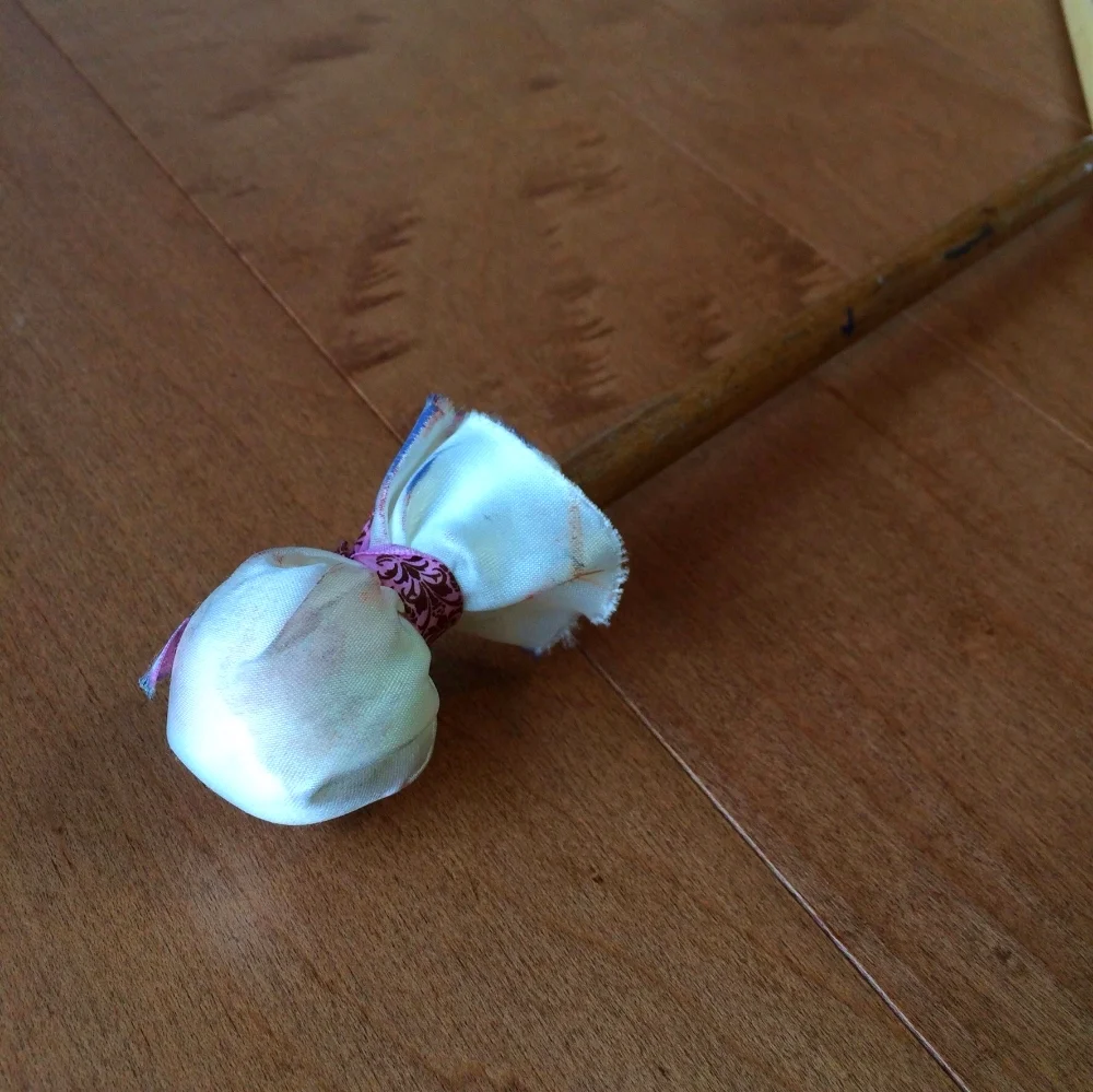 My Mahl stick with a piece of leftover ribbon from my wedding. :)