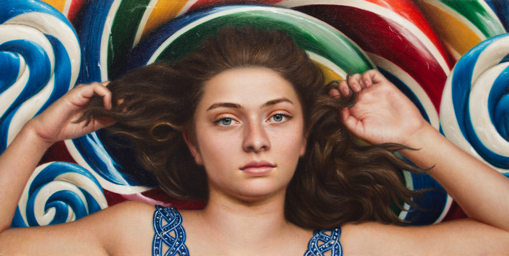 A girl with a background of multicolored lollipops.