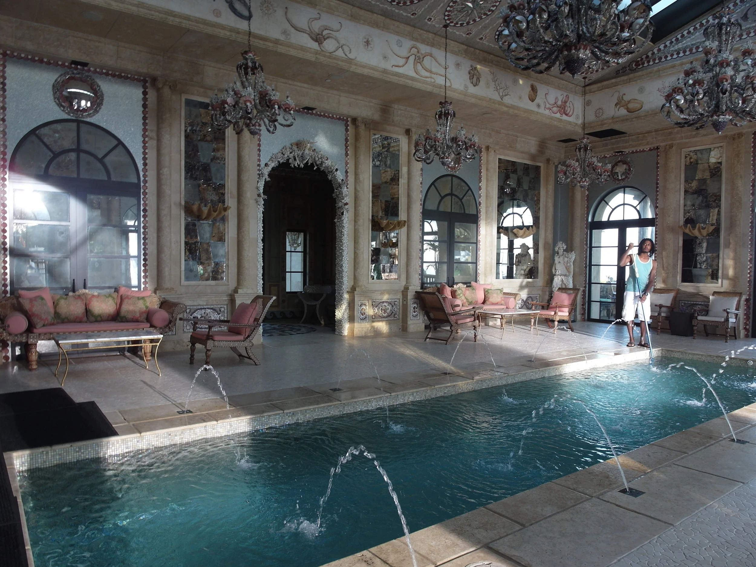 INT. MANSION - INDOOR POOL