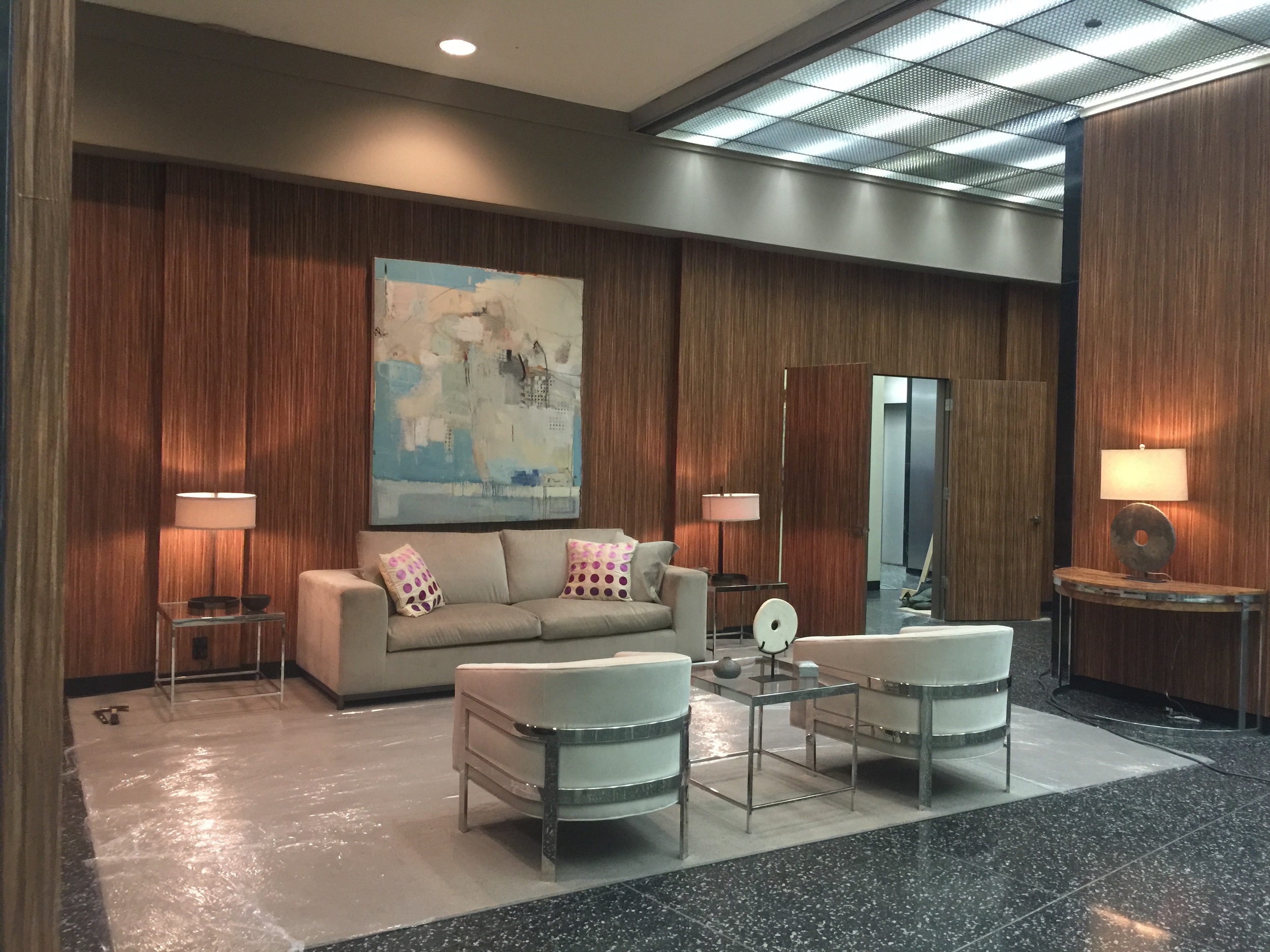 INT. WAITING AREA - HHV LAW OFFICES