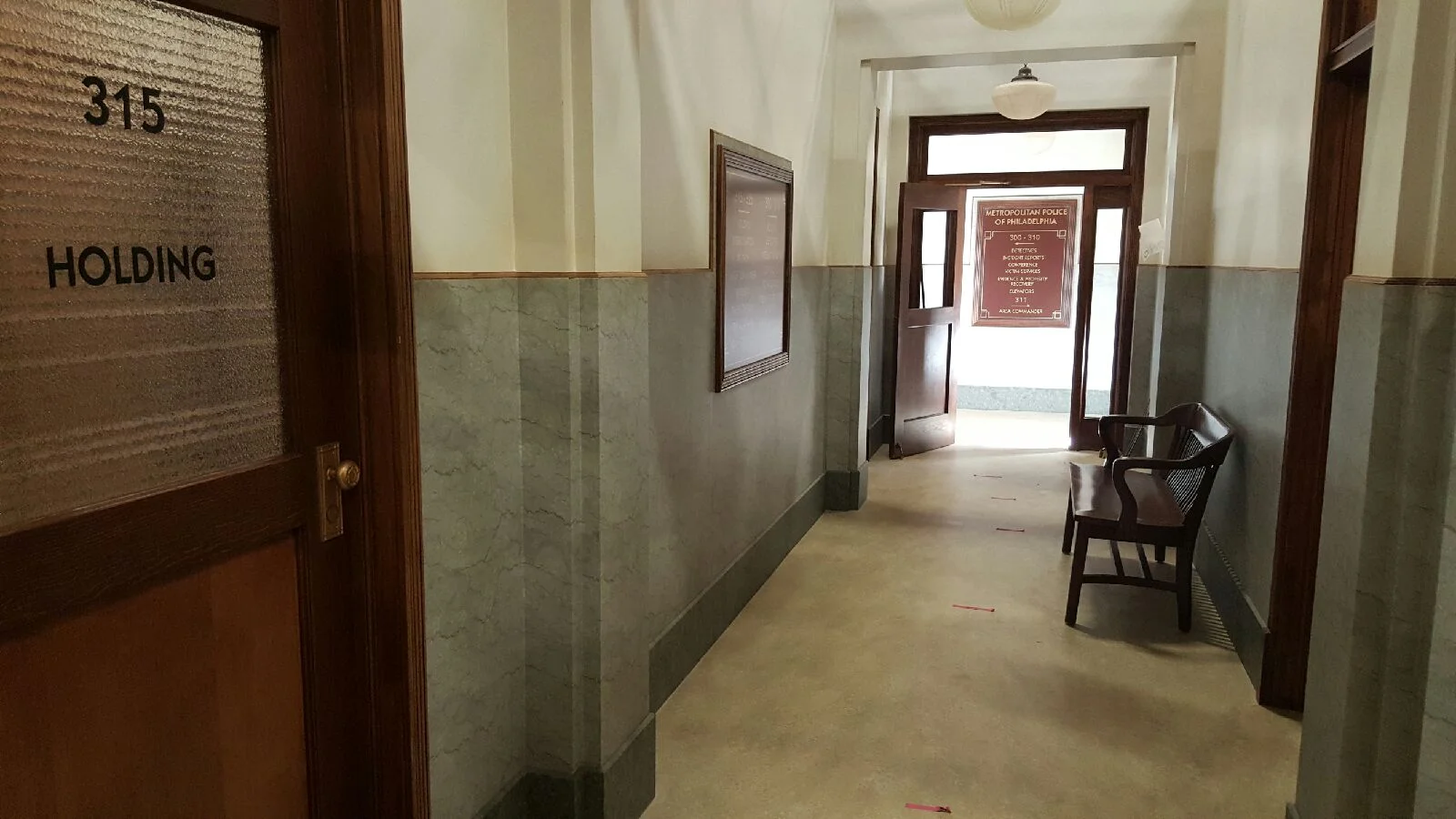 INT. POLICE STATION, DISTRICT 19 - HALLWAY