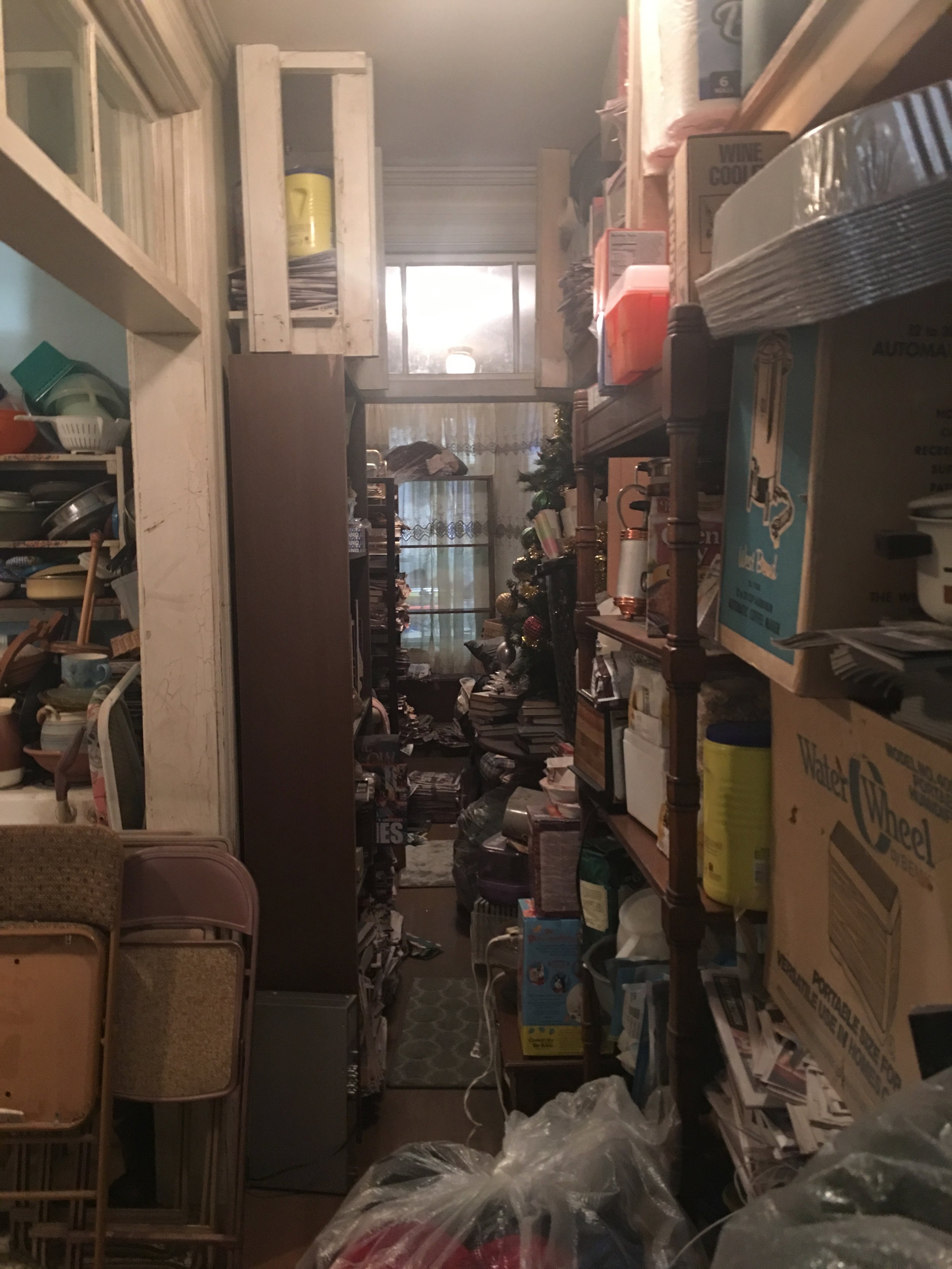 INT. HOARDER HOUSE