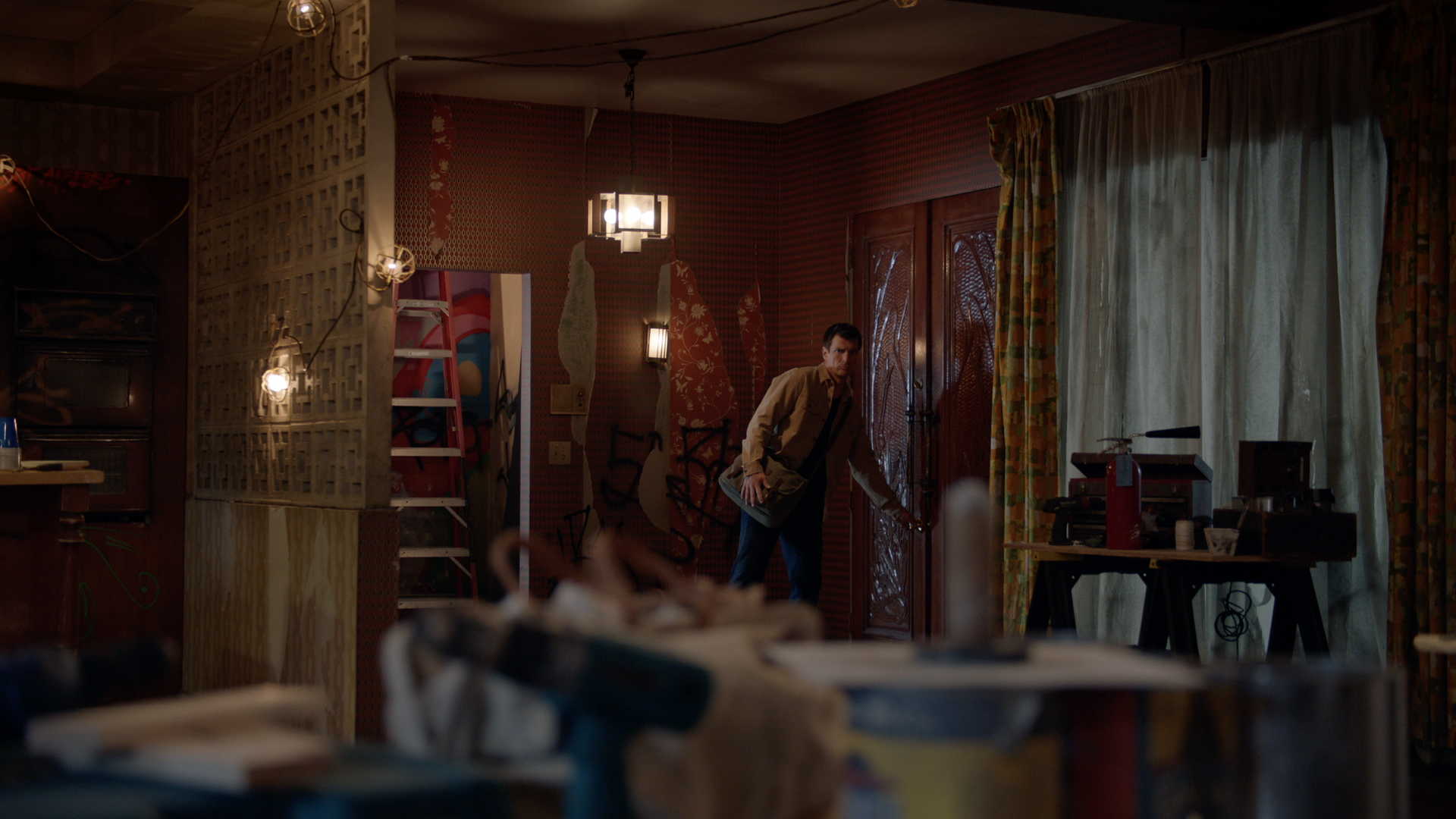 INT. NOLAN'S FIXER-UPPER - STAGE BUILD