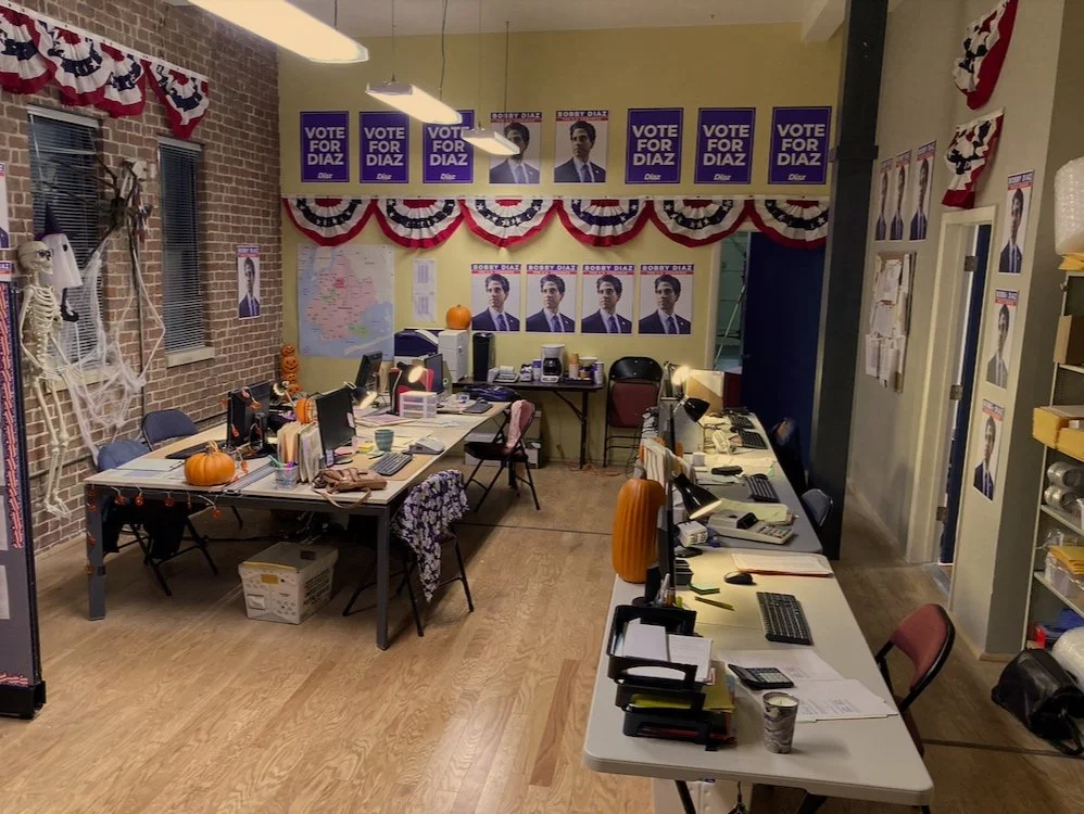 INT. BOBBY DIAZ CAMPAIGN HQ - 3 WORLDS