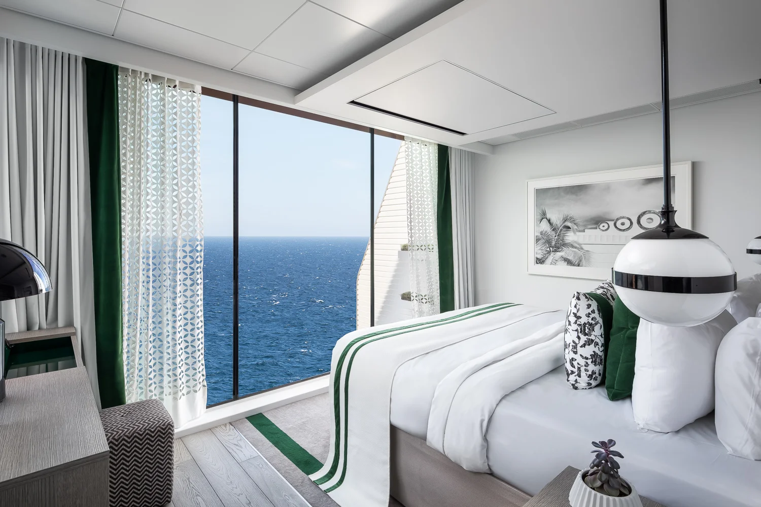 Bedroom in the Edge Villa. The curtains are remote-controlled so you don’t have to get out of bed to open up that amazing view in the morning. Your personal butler will bring the coffee too!