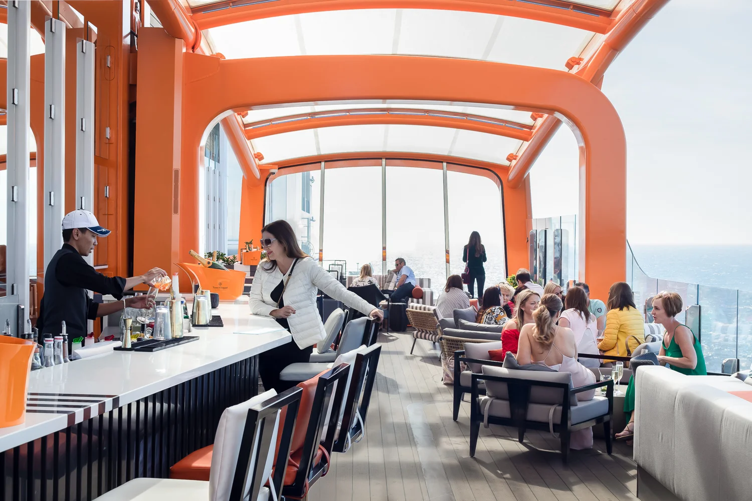 Magic Carpet. This cantilevered, floating platform can either be lowered to sea level for a luxury excursion embarkation, risen up to deck 13 for poolside drinks or found somewhere between as an alfresco dining option outside one of the restaurants. An engineering marvel!