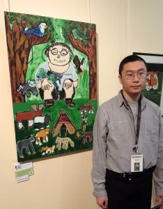 Jimmy Shum next to his work 'Jimmy is Sitting'