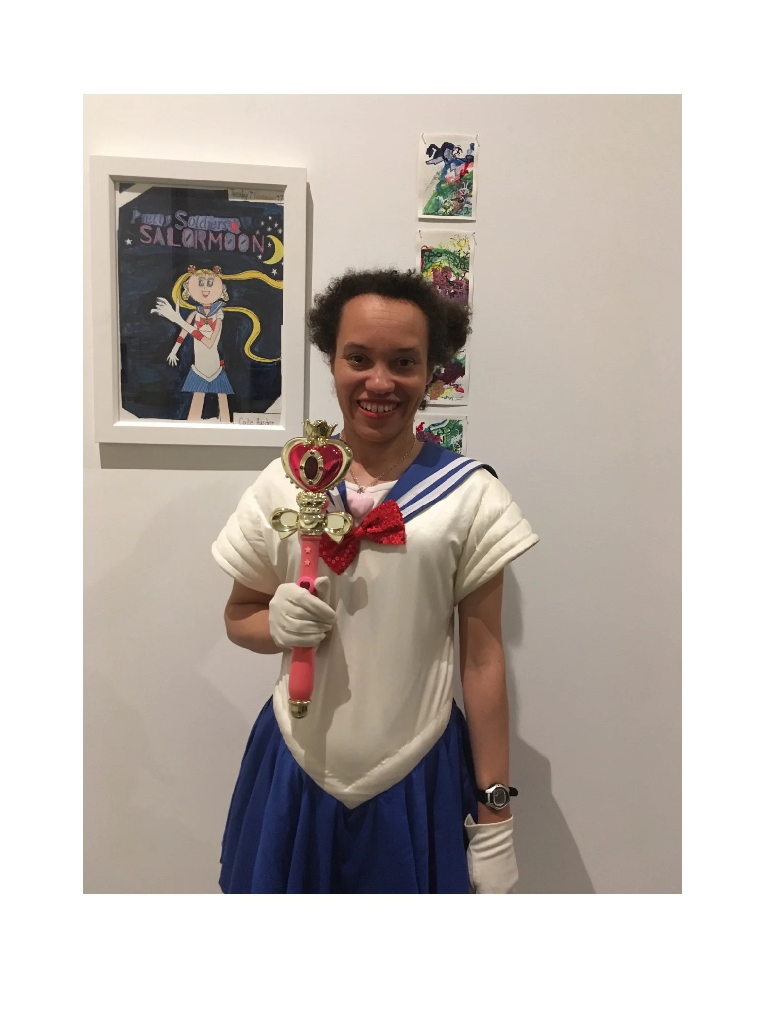Callie Hunter in front of her painting, Sailor Moon