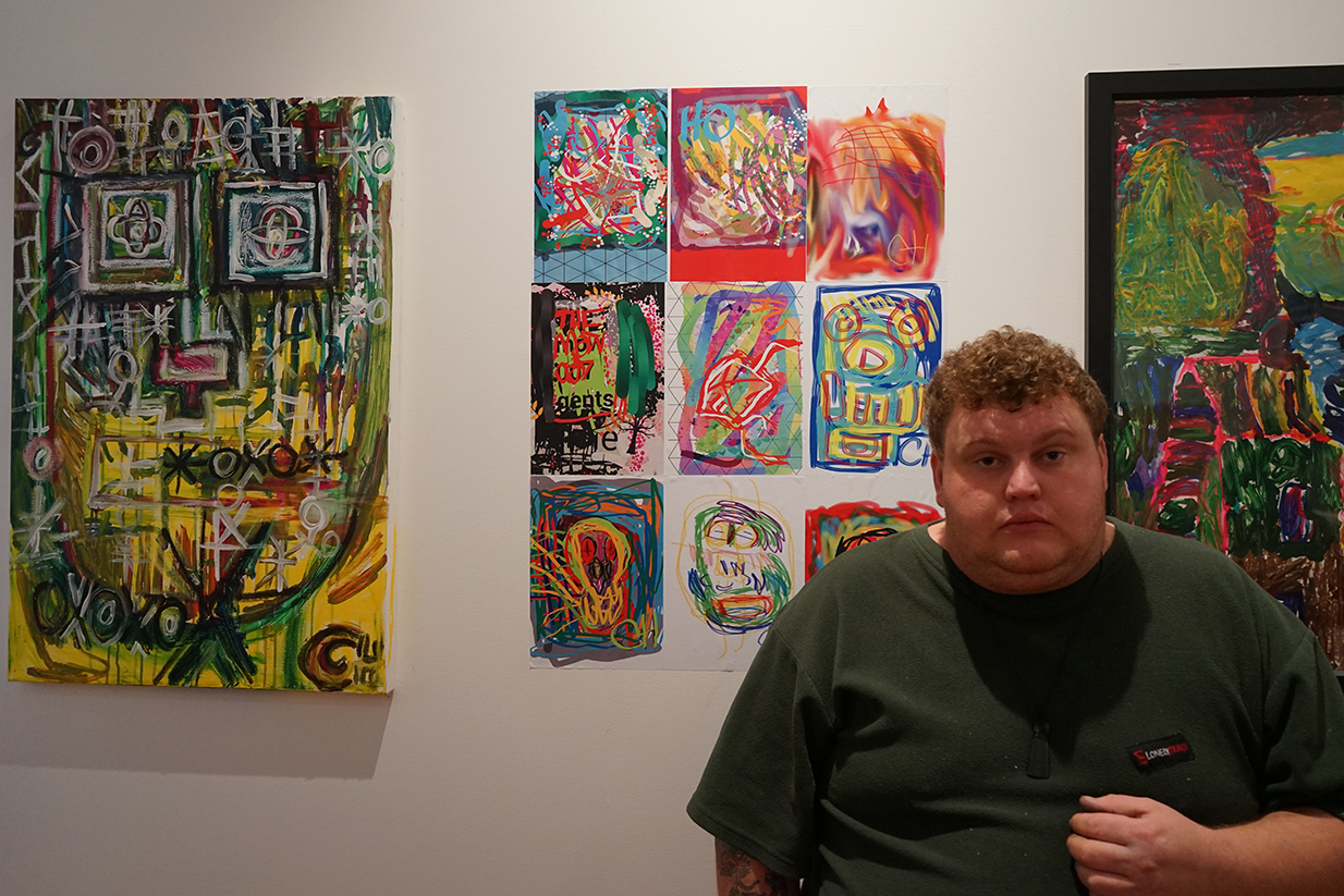 Colin Harris with his two artworks
