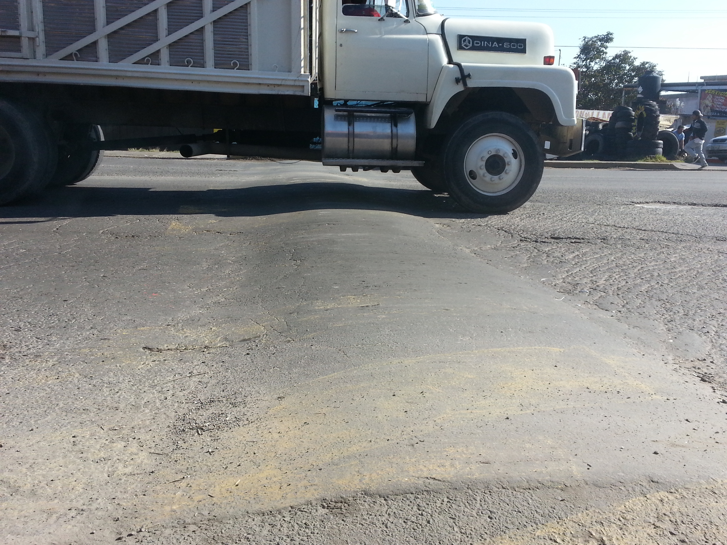 Speed bump...looks harmless, but inflicts pain to bike and body.
