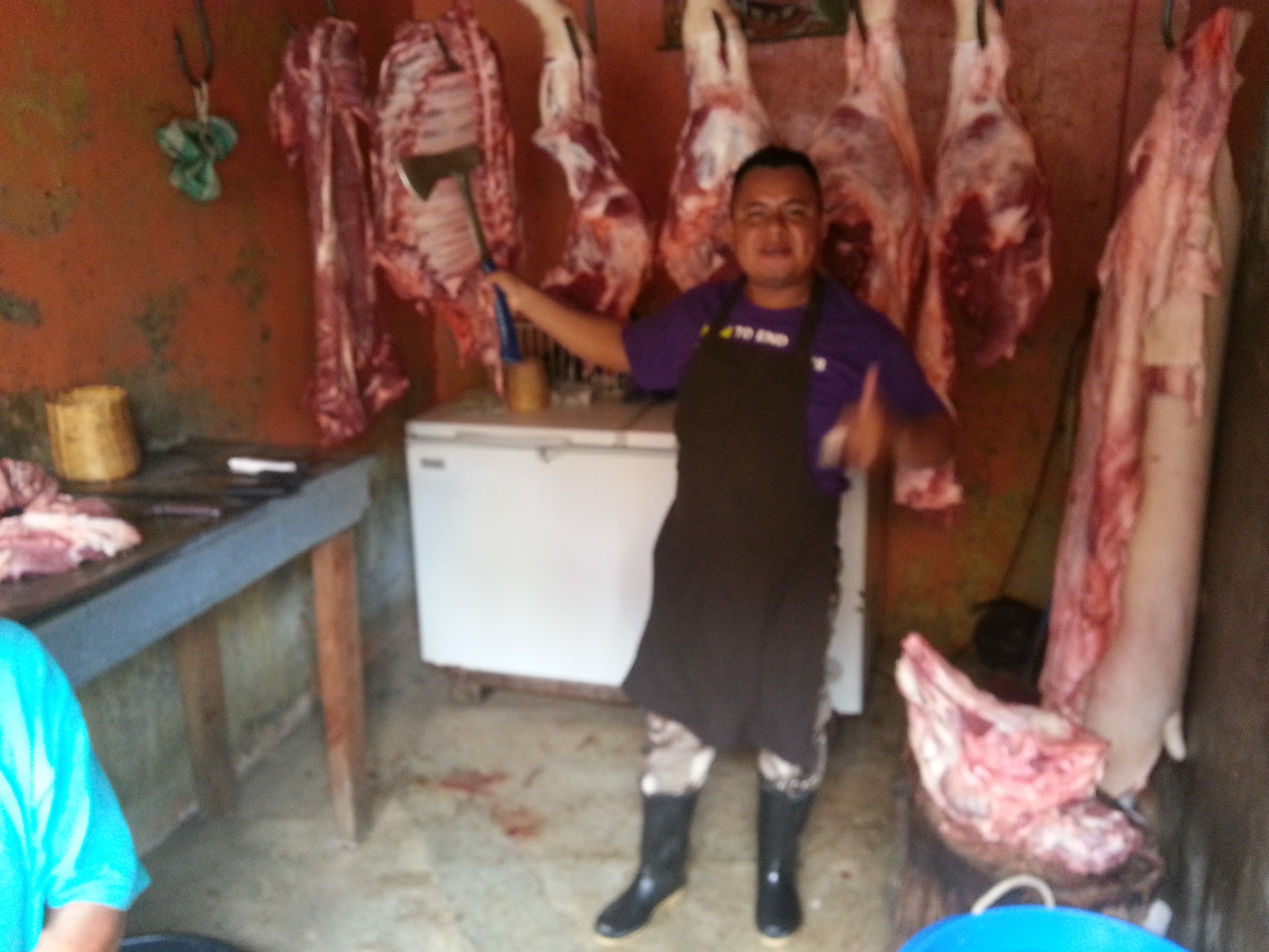 Local butcher enjoys his work...