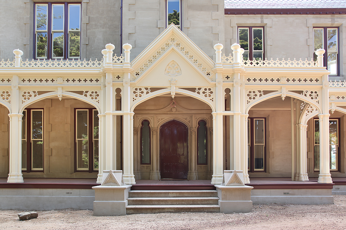 Heritage home decorative verandah posts fretwork and arches.jpg