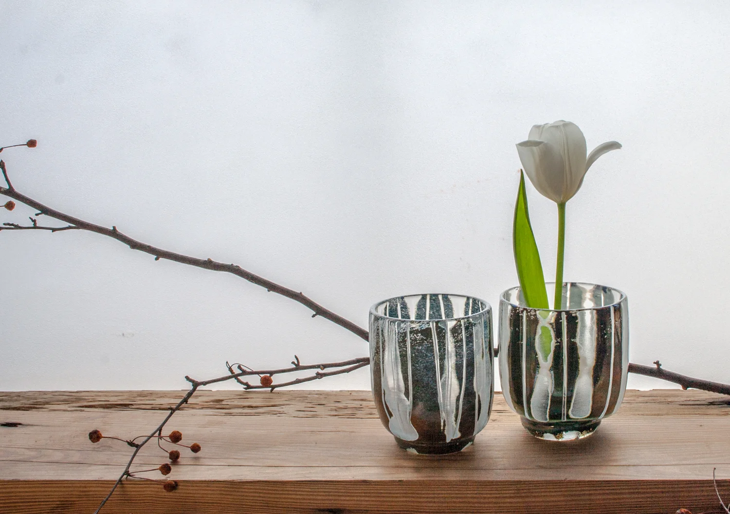 CARVED / this series uses a technique of rough carving blown pieces and them partially fire-polishing them. Forms include bowls, vases and yunomi ( Japanese tea cup ) here I'm exploring my life time obsessions with intuitive mark making, pattern traditions, windows, and trying to introduce more tactility to glass. SHOP CUPS