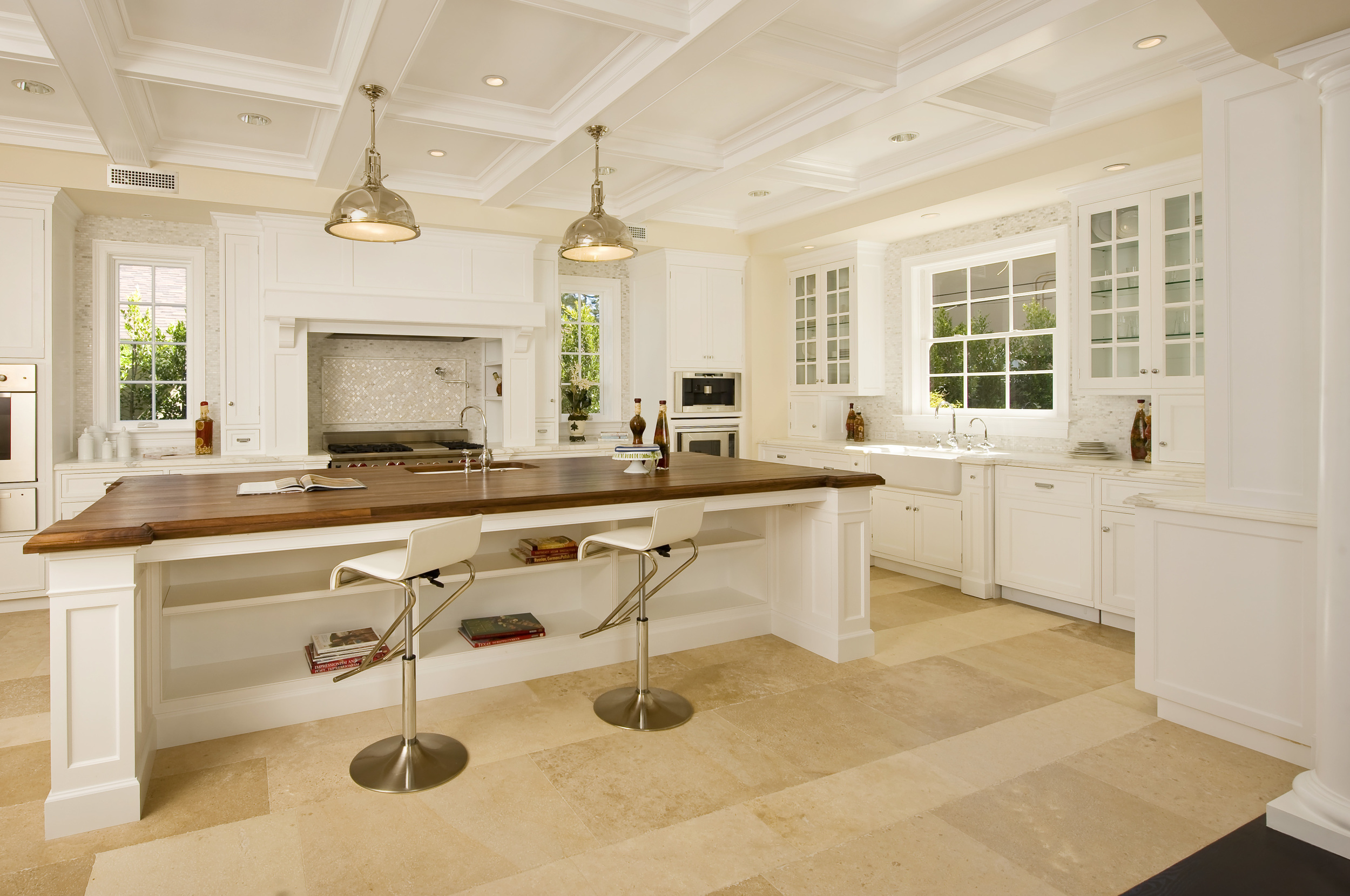 Empire Group. Brentwood Development traditional Kitchen, showing walnut top Island and broken line cabinetry.