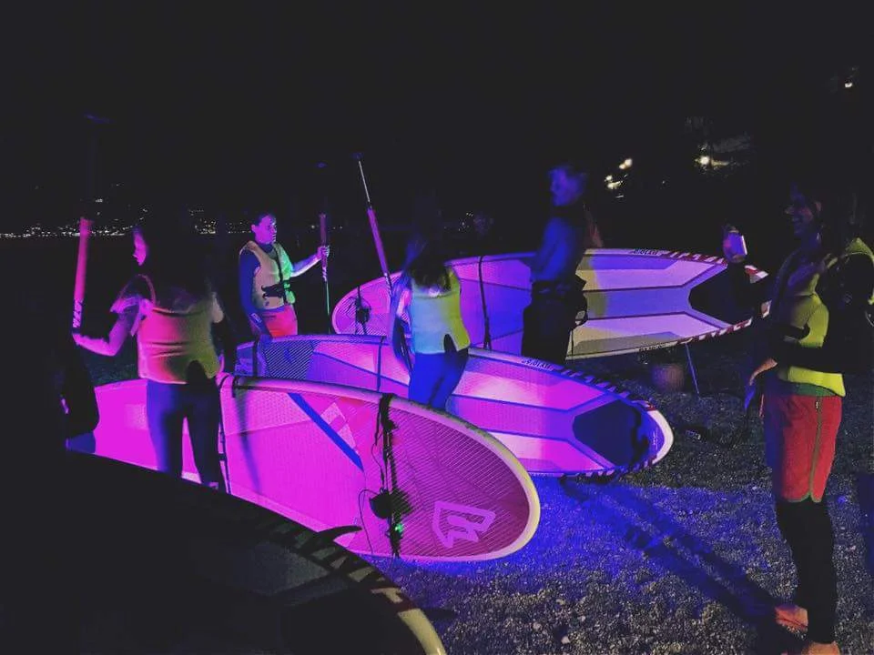 preparing at the beach for the night SUP tour