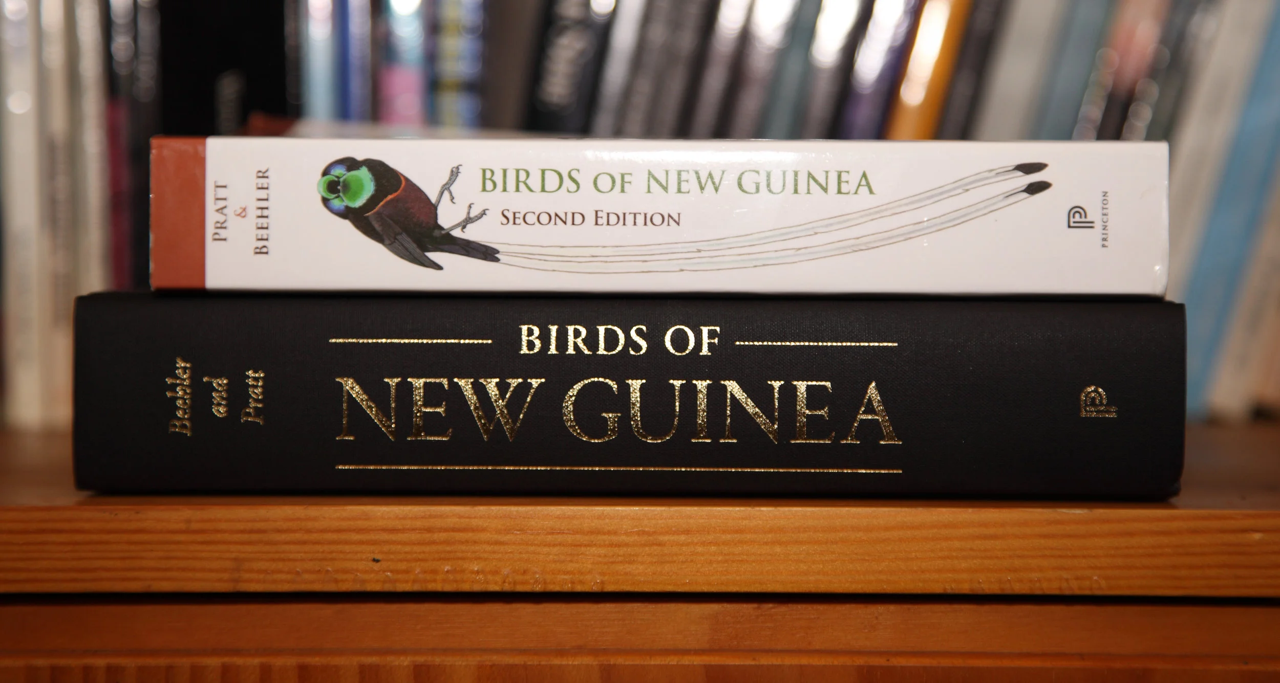 Birds of New Guinea DTS (bottom) with its dust jacket off.