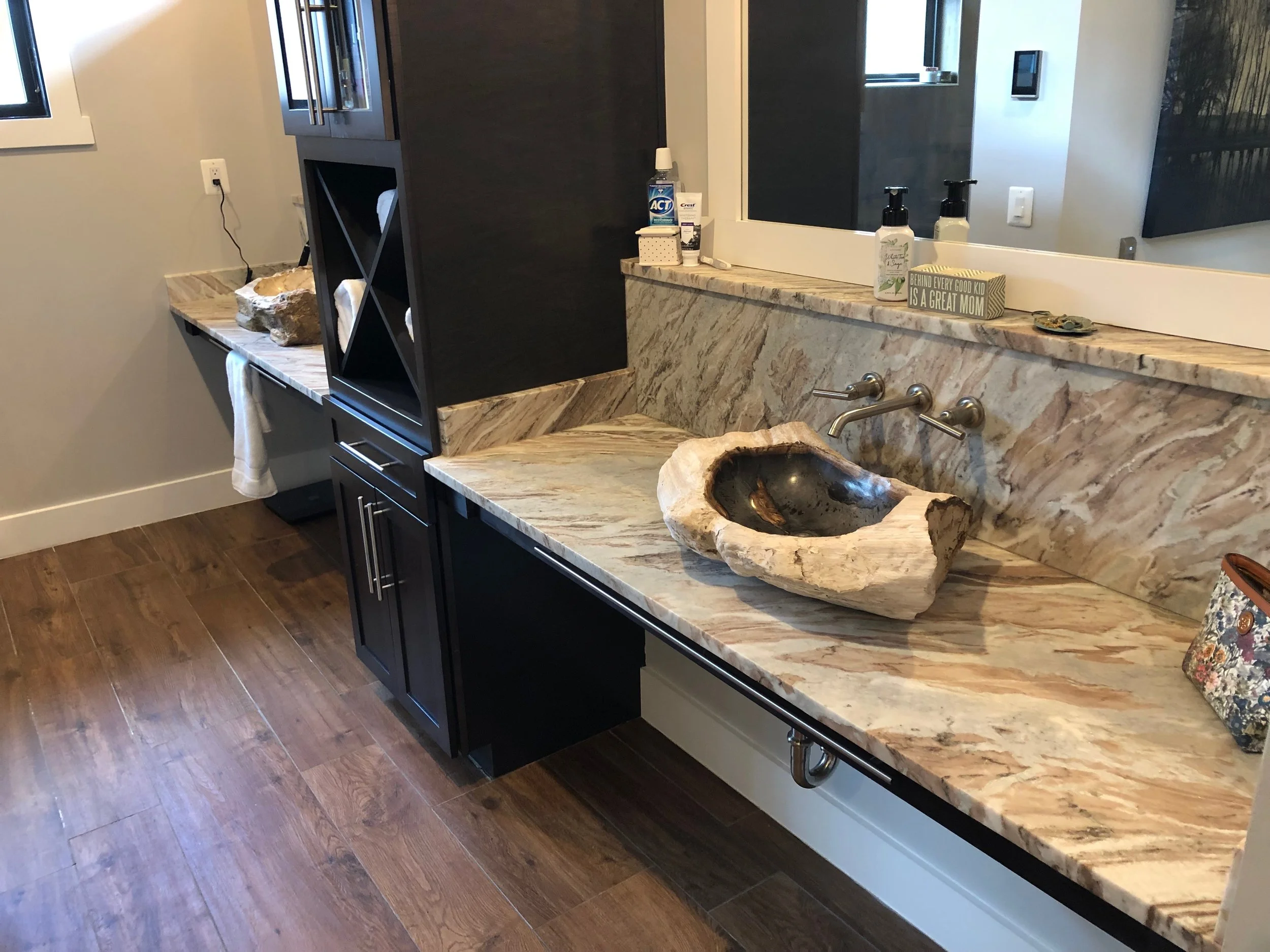 Master bath petrified wood sinks.