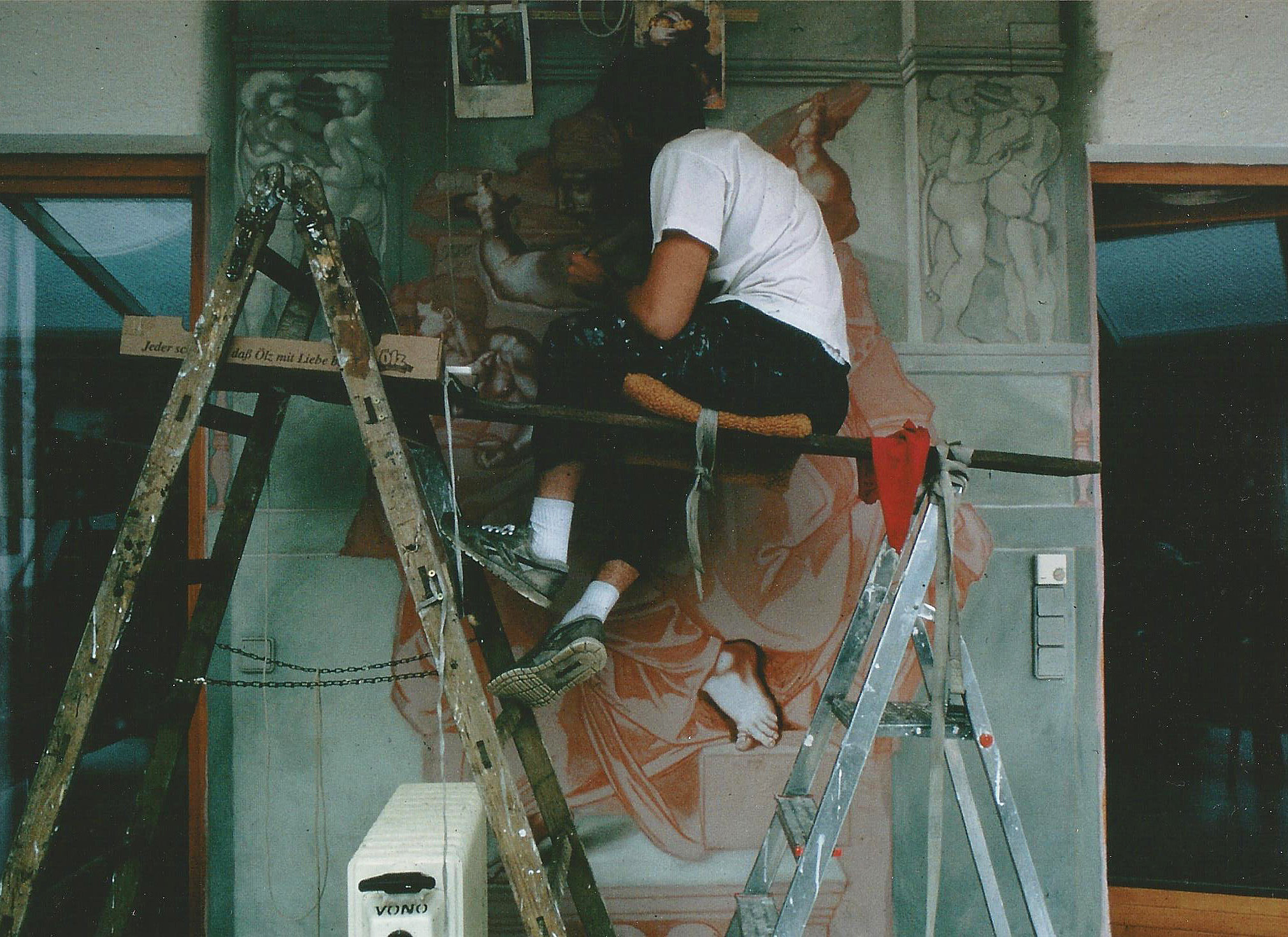 A photo of me painting the above Libica with an improvised scaffold.
