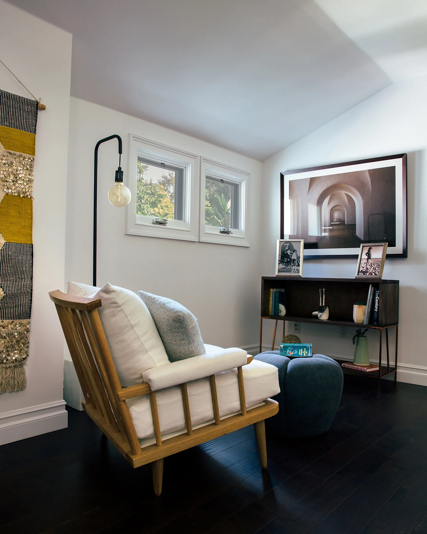 QUIET CORNER What to do with an extra-wide hallway? Create a cozy spot for a book.