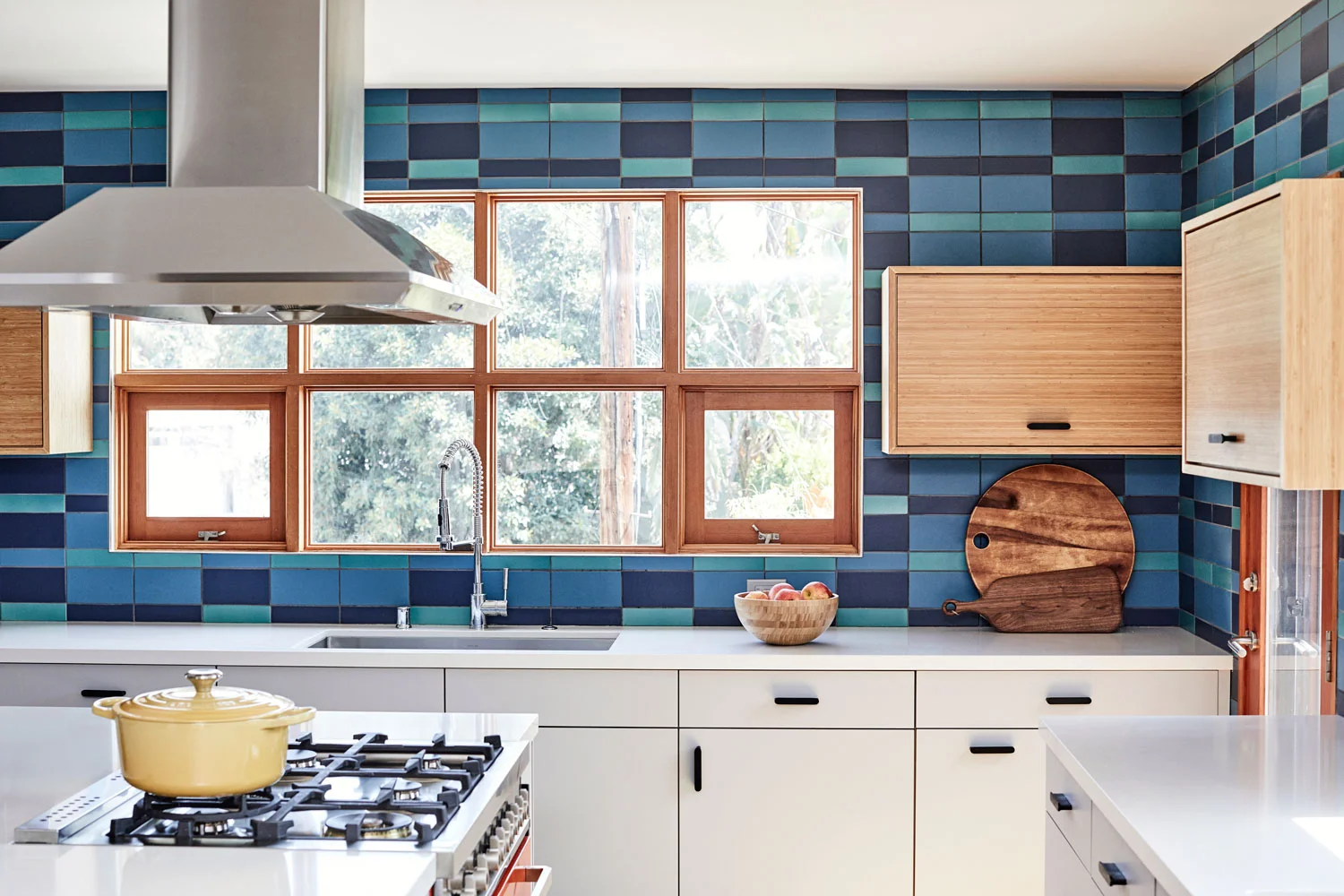 A custom-blend of Fireclay Tile in a surprising plaid pattern made the mid-century modern statement our clients’ wanted.