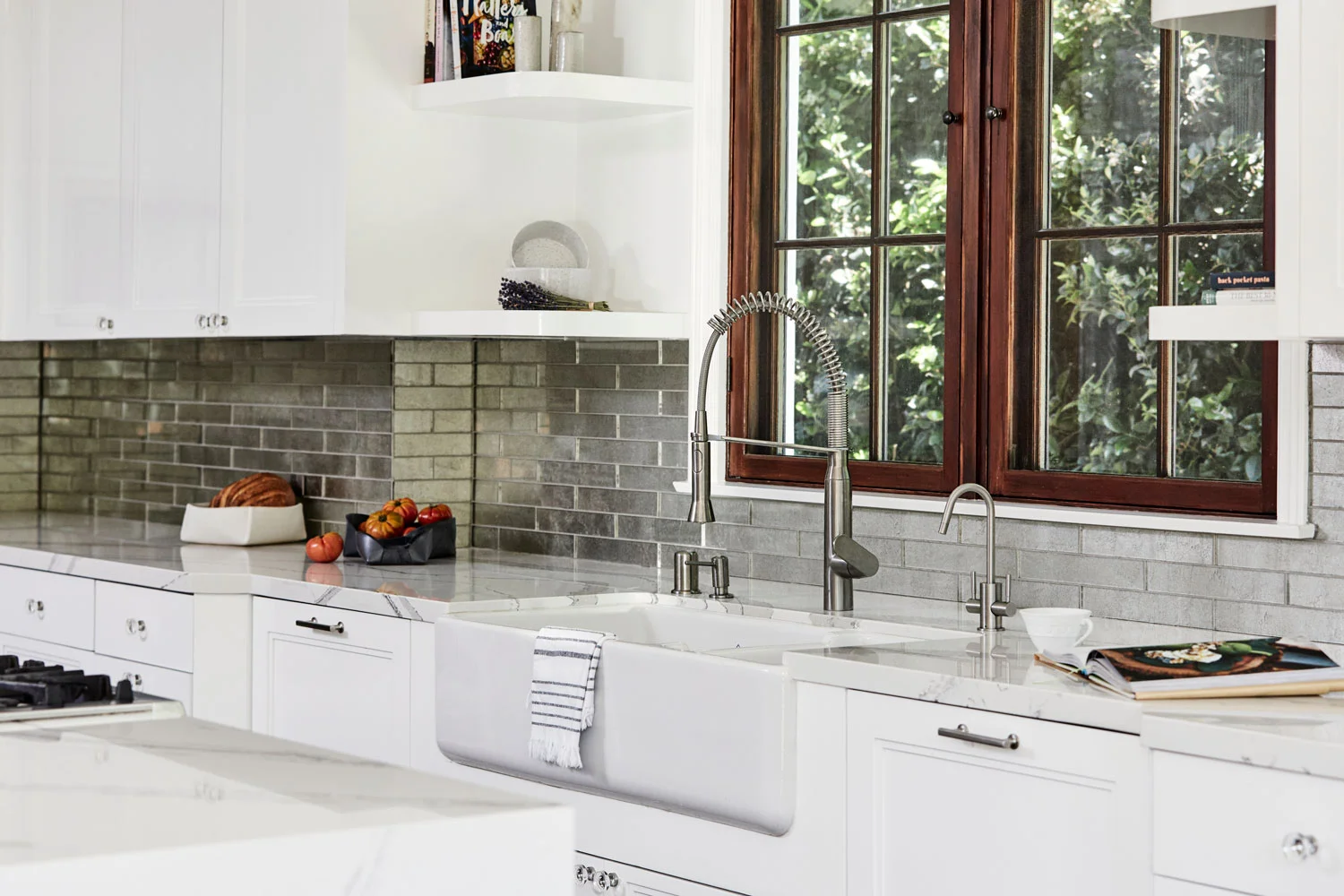 These antique-mirrored glass tile from Ann Sacks were a perfect material to bridge our modern meets classic look.