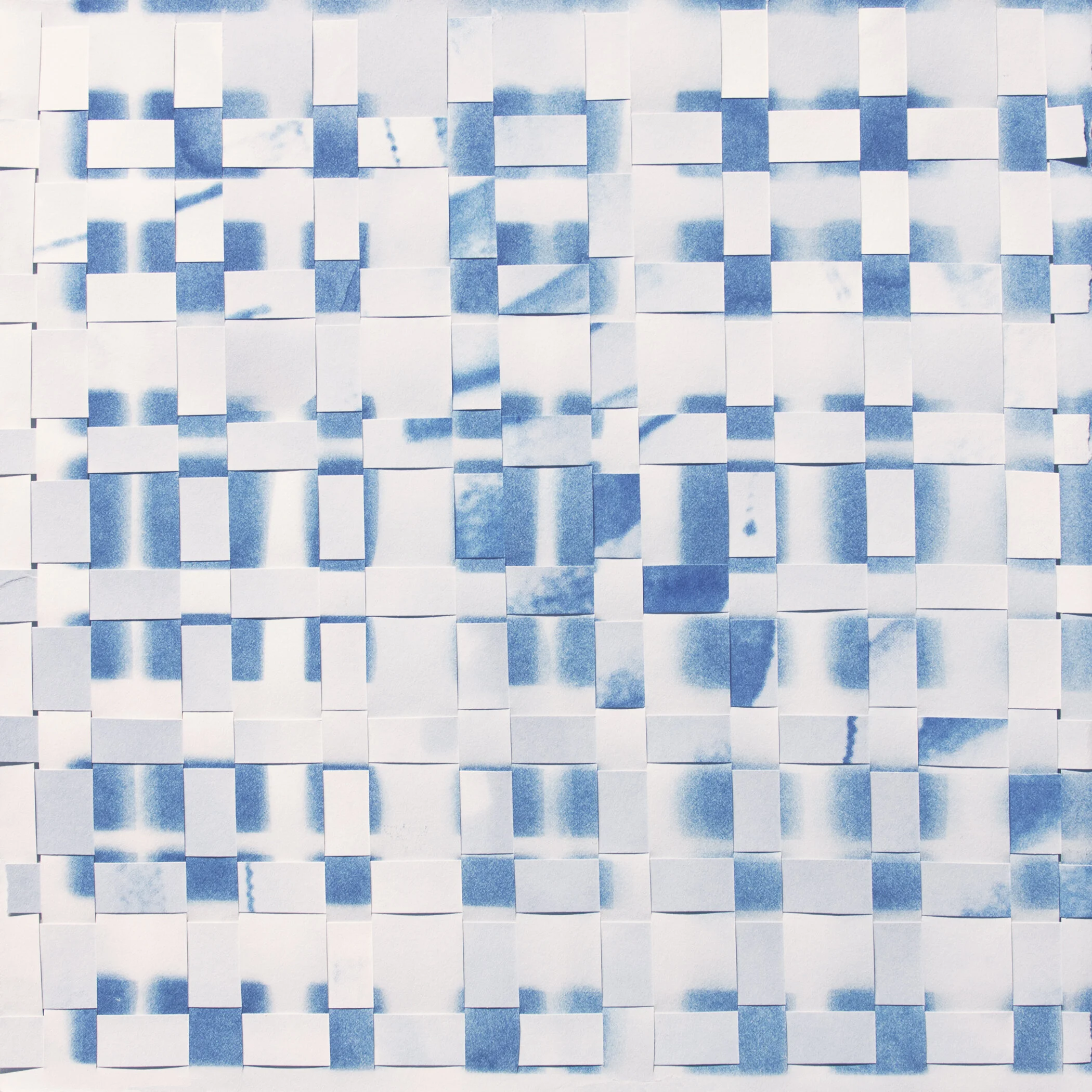 untitled (woven grid 005). 2019. two cyanotype prints on paper, physically cut and woven together by hand. 12 x 12 inches