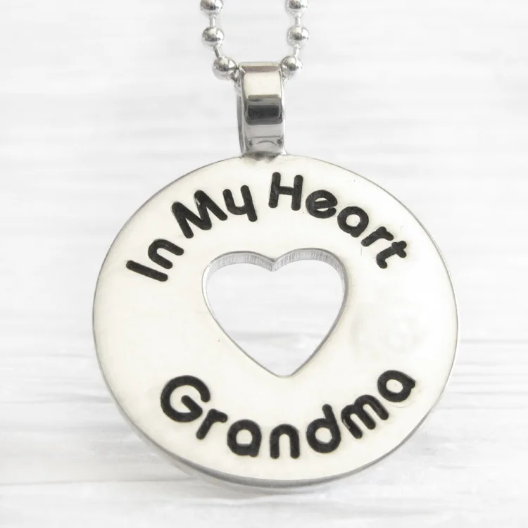 Sterling silver memorial necklace with heart and engraved name.jpg
