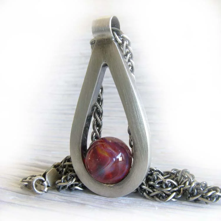 Affinity glass creamtion teardrop pendant handmade from sterling silver.jpg