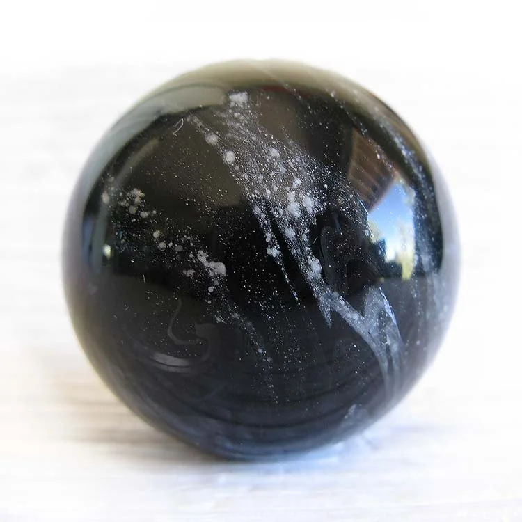 Handblown memorial glass marble infused with creamtion ashes