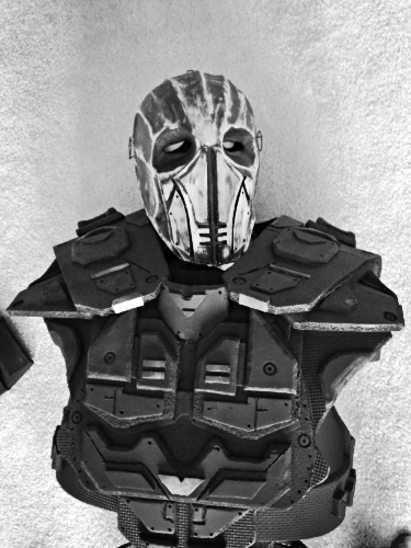 After designing the character for Thy Neighbor, I decided to create a custom build of the suit to put on display at the 2013 Gallery exhibit at Illinois Central College. Materials used include wire, paper machet, e.v.a foam, craft foam and various paints. This lightweight costume felt great and held together nicely.